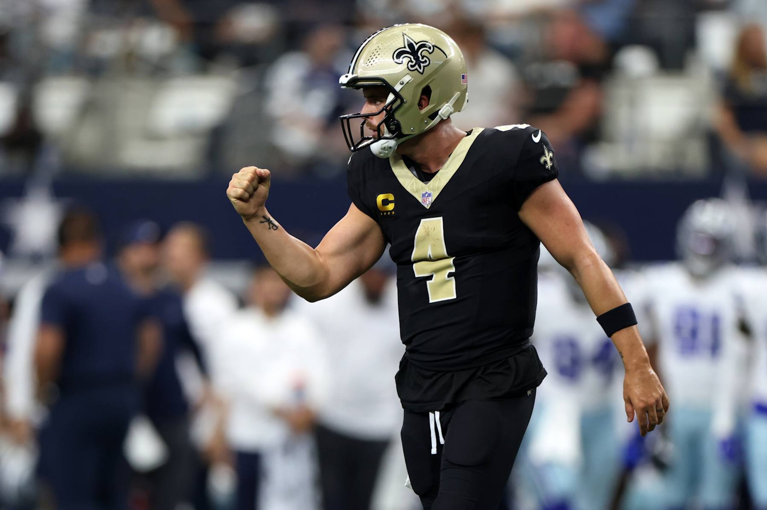 ARLINGTON, TEXAS - SEPTEMBER 15: Derek Carr #4 of the New Orleans Saints celebrates a touchdown pass during the third quarter against the Dallas Cowboys at AT&T Stadium on September 15, 2024 in Arlington, Texas. (Photo by Ron Jenkins/Getty Images) ARLINGTON, TEXAS - SEPTEMBER 15: Derek Carr #4 of the New Orleans Saints celebrates a touchdown pass during the third quarter against the Dallas Cowboys at AT&T Stadium on September 15, 2024 in Arlington, Texas. (Photo by Ron Jenkins/Getty Images)