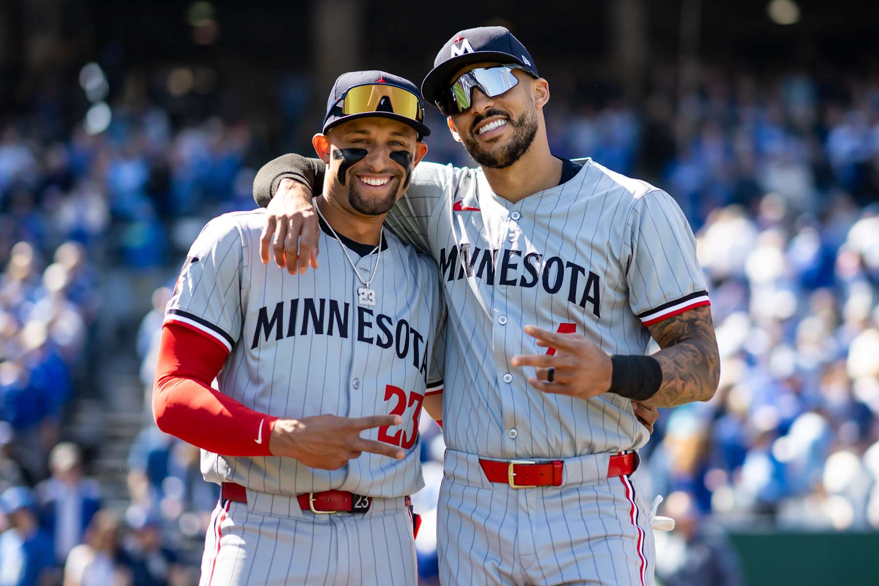 KANSAS CITY, MO - MARCH 28: Royce Lewis #23 and Carlos Correa #4 of the Minnesota Twins look on and pose for a photo prior to the game against the Kansas City Royals on March 28, 2024 at Kauffman Stadium in Kansas City, Missouri. (Photo by Brace Hemmelgarn/Minnesota Twins/Getty Images)