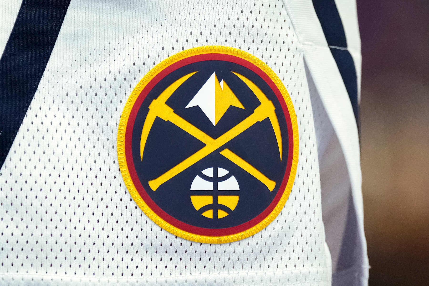 DETROIT, MICHIGAN - NOVEMBER 20: A detail of the Denver Nuggets uniform and logo against the Detroit Pistons at Little Caesars Arena on November 20, 2023 in Detroit, Michigan. NOTE TO USER: User expressly acknowledges and agrees that, by downloading and or using this photograph, User is consenting to the terms and conditions of the Getty Images License Agreement. (Photo by Nic Antaya/Getty Images)
