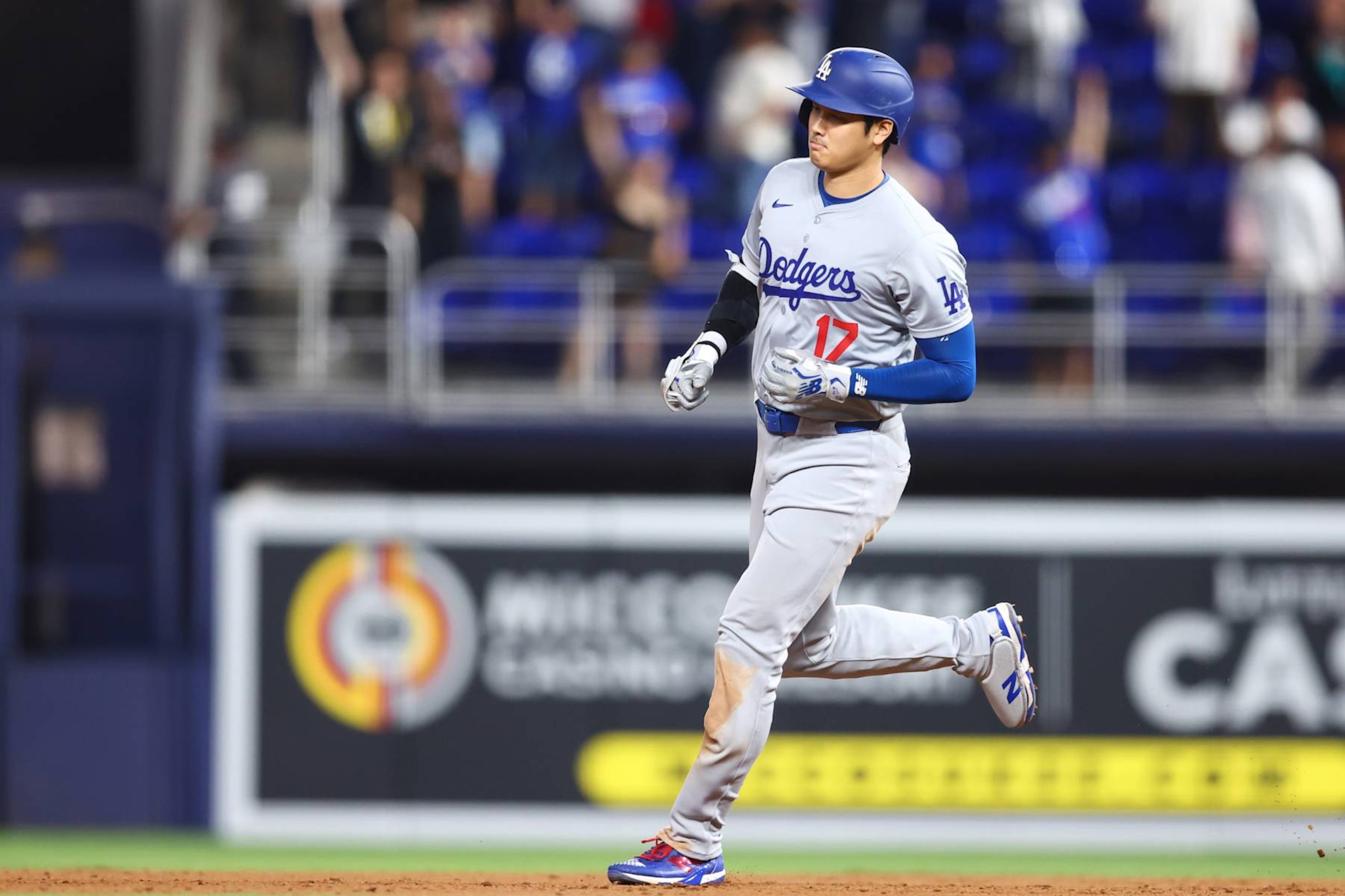 MIAMI, FLORIDA - SEPTEMBER 19: Shohei Ohtani #17 of the Los Angeles Dodgers runs the bases after hitting a three-run home run, his third home run of the game, during the ninth inning against the Miami Marlins at loanDepot park on September 19, 2024 in Miami, Florida. (Photo by Megan Briggs/Getty Images)