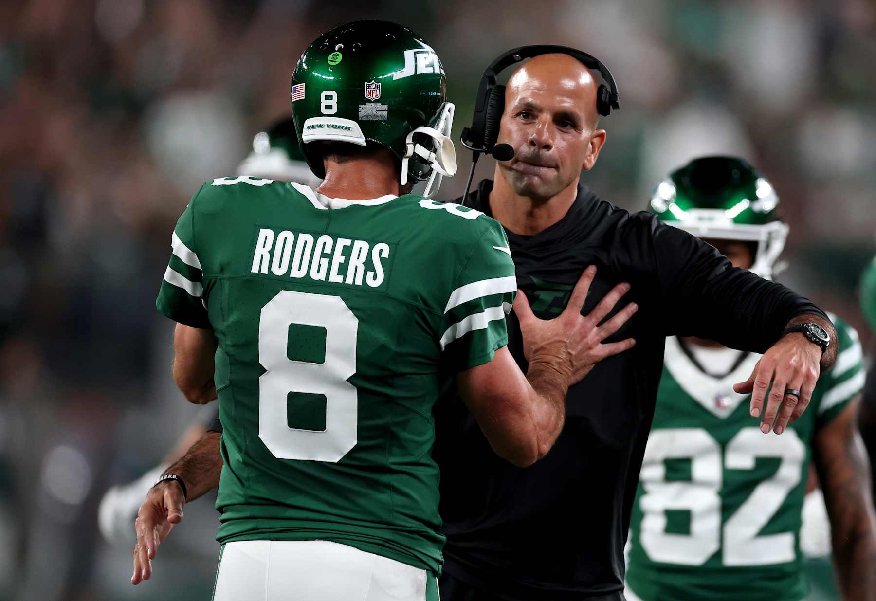 EAST RUTHERFORD, NEW JERSEY - SEPTEMBER 19: Head coach Robert Saleh of the New York Jets celebrates with Aaron Rodgers #8 after a touchdown against the New England Patriots during the second quarter in the game at MetLife Stadium on September 19, 2024 in East Rutherford, New Jersey. (Photo by Al Bello/Getty Images)