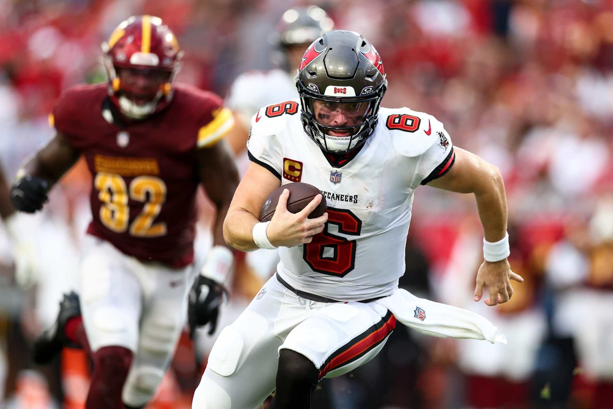 TAMPA, FL - SEPTEMBER 8: Baker Mayfield #6 of the Tampa Bay Buccaneers carries the ball during an NFL football game against the Washington Commanders at Raymond James Stadium on September 8, 2024 in Tampa, Florida. (Photo by Kevin Sabitus/Getty Images)
