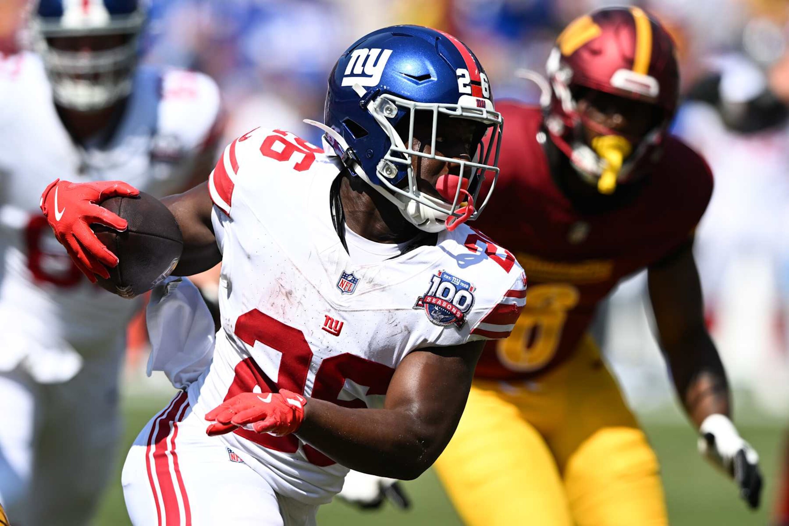 LANDOVER, MARYLAND - SEPTEMBER 15: Devin Singletary #26 of the New York Giants runs for a touchdown during the first quarter against the Washington Commanders at Northwest Stadium on September 15, 2024 in Landover, Maryland. (Photo by Greg Fiume/Getty Images)