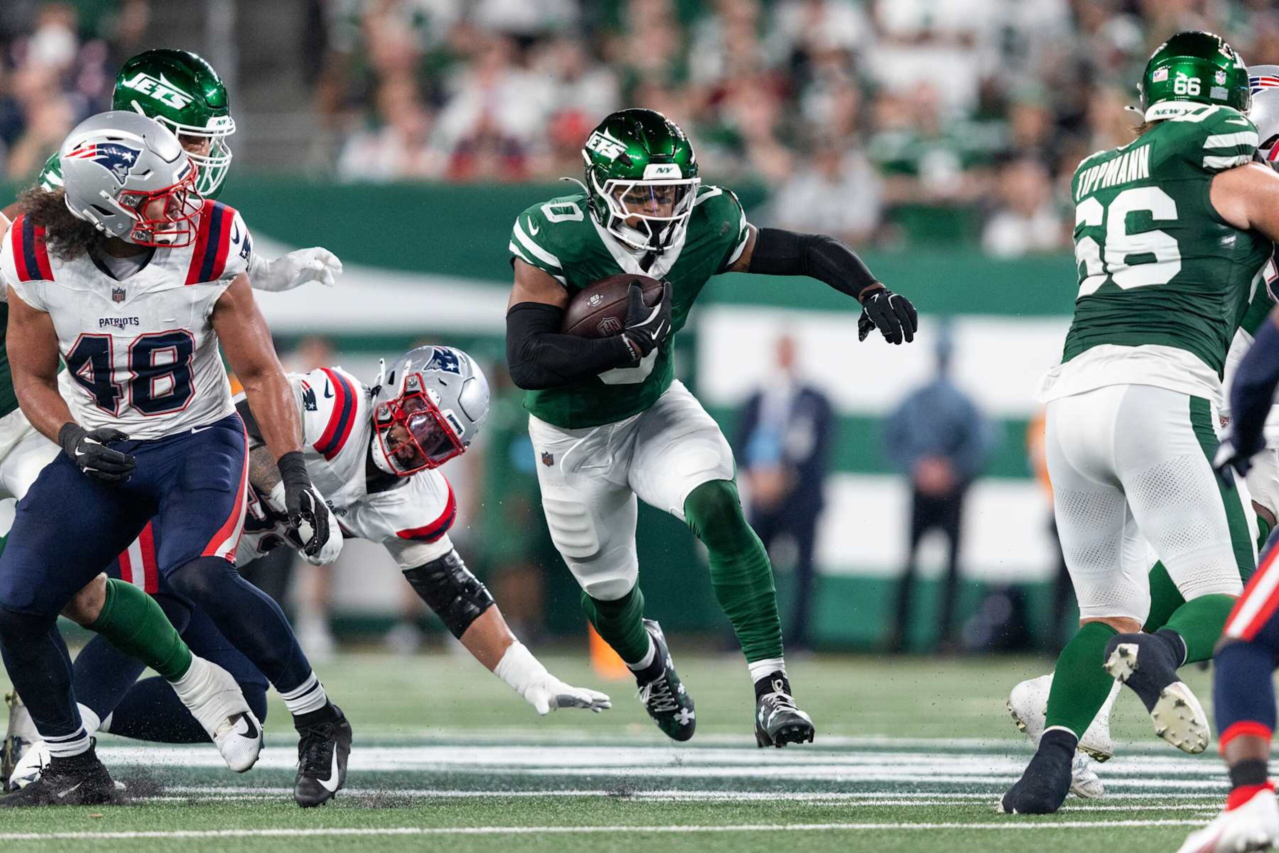 EAST RUTHERFORD, NEW JERSEY - SEPTEMBER 19: Braelon Allen #0 of the New York Jets runs with the ball during an NFL football game between the New York Jets and the New England Patriots at MetLife Stadium on September 19, 2024 in East Rutherford, New Jersey. (Photo by Michael Owens/Getty Images)