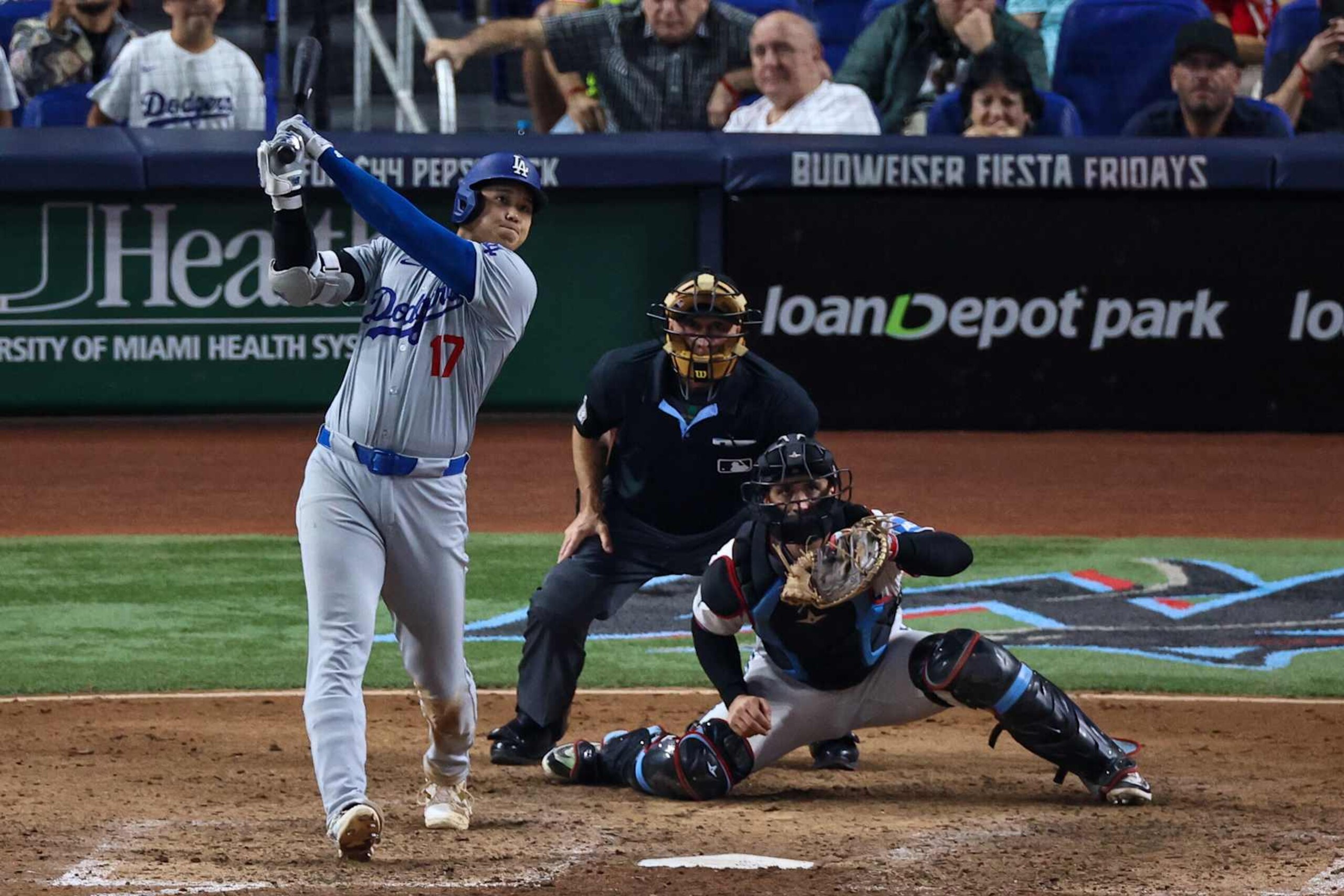 MIAMI, FLORIDA - SEPTEMBER 19: Shohei Ohtani #17 of the Los Angeles Dodgers at bat in the seventh inning during the game against Miami Marlins at loanDepot park on September 19, 2024 in Miami, Florida. Ohtani is now the first player in MLB history to reach 50 home runs and 50 stolen bases in a single season. (Photo by Chris Arjoon/Getty Images)