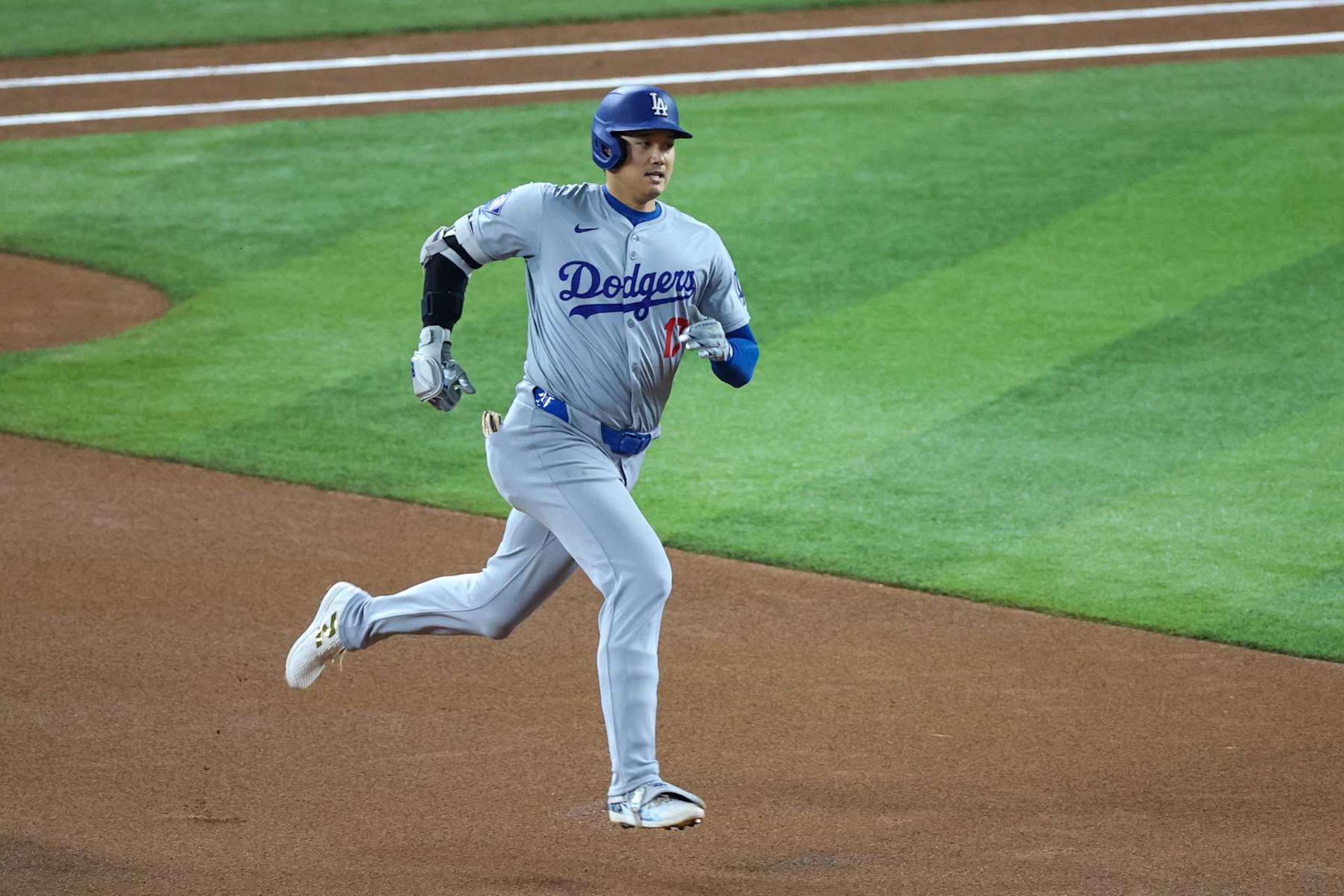 MIAMI, FLORIDA - SEPTEMBER 19: Shohei Ohtani #17 of the Los Angeles Dodgers runs to second base in the first inning of the game against Miami Marlins at loanDepot park on September 19, 2024 in Miami, Florida. Ohtani is now the first player in MLB history to reach 50 home runs and 50 stolen bases in a single season. (Photo by Chris Arjoon/Getty Images)