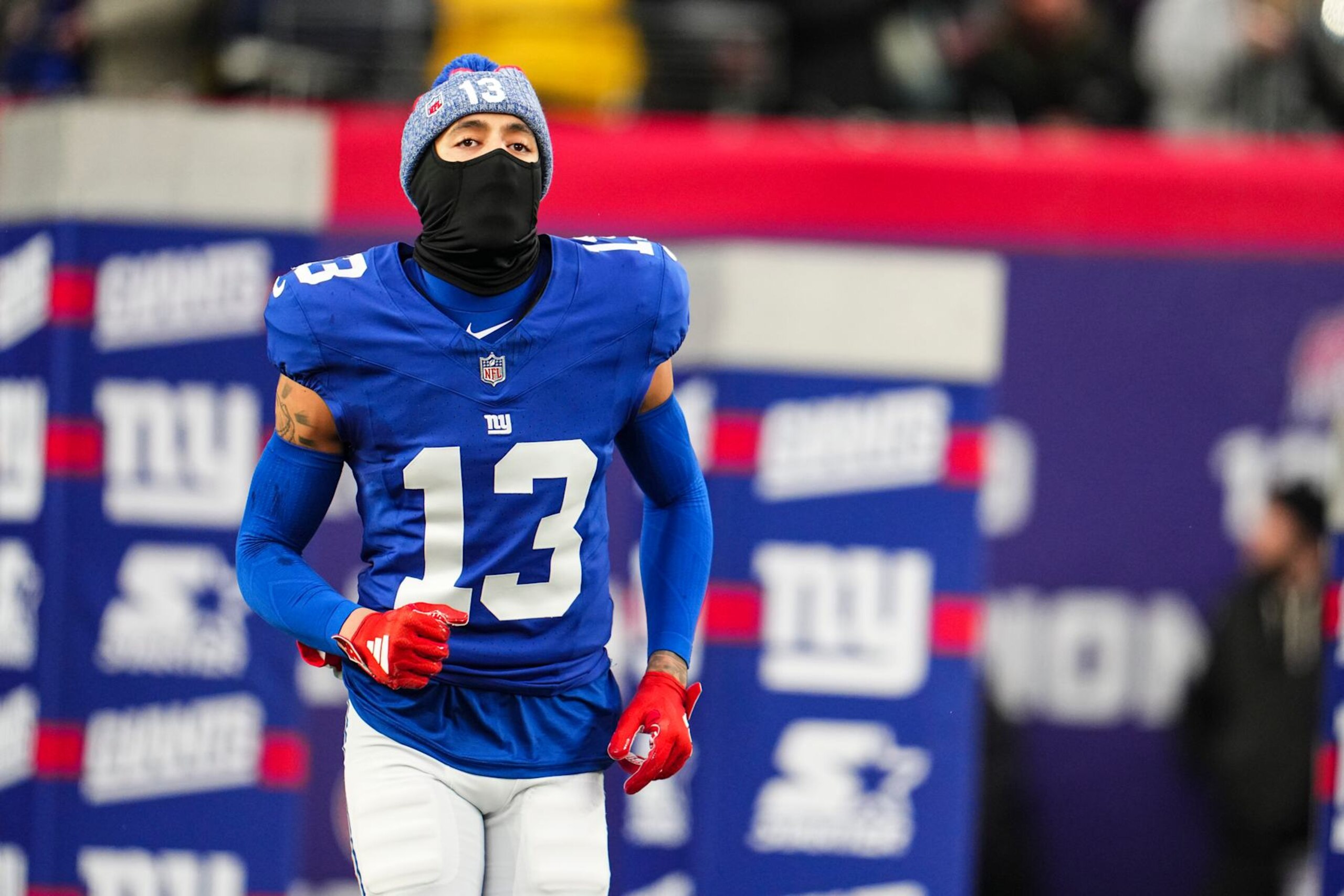 EAST RUTHERFORD, NJ - JANUARY 07: Jalin Hyatt #13 of the New York Giants runs out of the tunnel prior to an NFL football game against the Philadelphia Eagles at MetLife Stadium on January 7, 2024 in East Rutherford, New Jersey. (Photo by Cooper Neill/Getty Images)