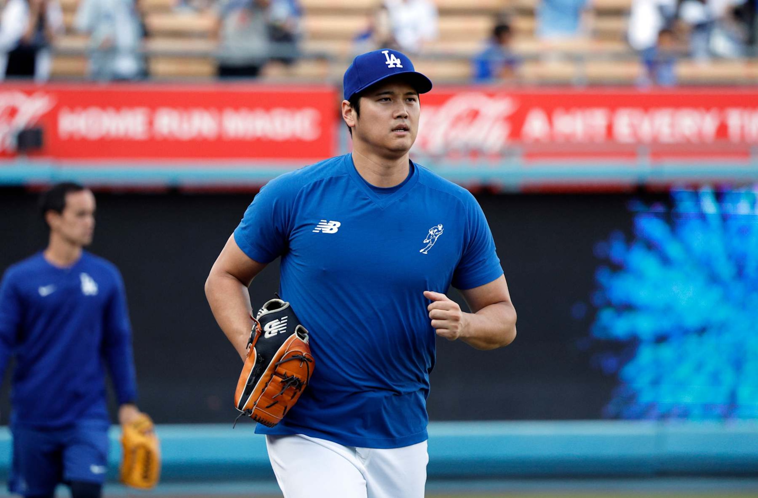LOS ANGELES, CALIFORNIA - SEPTEMBER 20: Shohei Ohtani #17 of the Los Angeles Dodgers jogs back to the dugout after throwing in the outfield before the game against the Colorado Rockies at Dodger Stadium on September 20, 2024 in Los Angeles, California. (Photo by Kevork Djansezian/Getty Images) LOS ANGELES, CALIFORNIA - SEPTEMBER 20: Shohei Ohtani #17 of the Los Angeles Dodgers jogs back to the dugout after throwing in the outfield before the game against the Colorado Rockies at Dodger Stadium on September 20, 2024 in Los Angeles, California. (Photo by Kevork Djansezian/Getty Images)