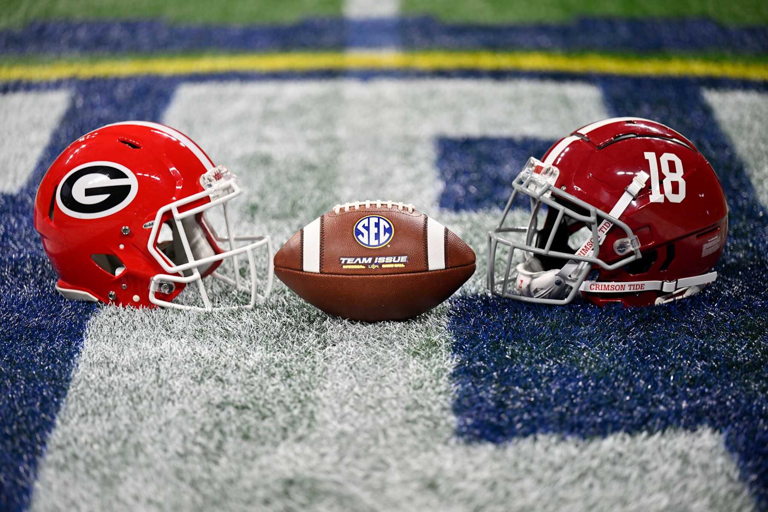ATLANTA, GEORGIA - DECEMBER 02: A view of the Georgia Bulldogs and Alabama Crimson Tide football helmets before the SEC Championship football game at Mercedes-Benz Stadium on December 02, 2023 in Atlanta, Georgia. (Photo by Alika Jenner/Getty Images) ATLANTA, GEORGIA - DECEMBER 02: A view of the Georgia Bulldogs and Alabama Crimson Tide football helmets before the SEC Championship football game at Mercedes-Benz Stadium on December 02, 2023 in Atlanta, Georgia. (Photo by Alika Jenner/Getty Images)