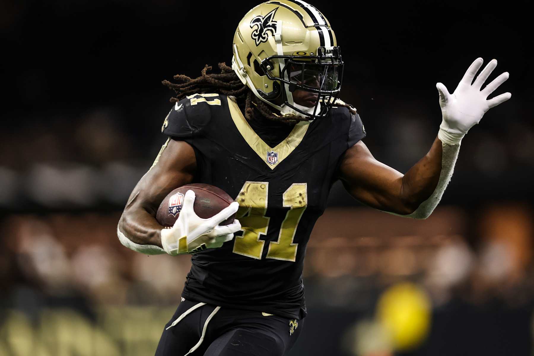 NEW ORLEANS, LA - SEPTEMBER 08: Alvin Kamara #41 of the New Orleans Saints runs the ball during an NFL football game against the Carolina Panthers at Caesars Superdome on September 8, 2024 in New Orleans, Louisiana. (Photo by Perry Knotts/Getty Images)