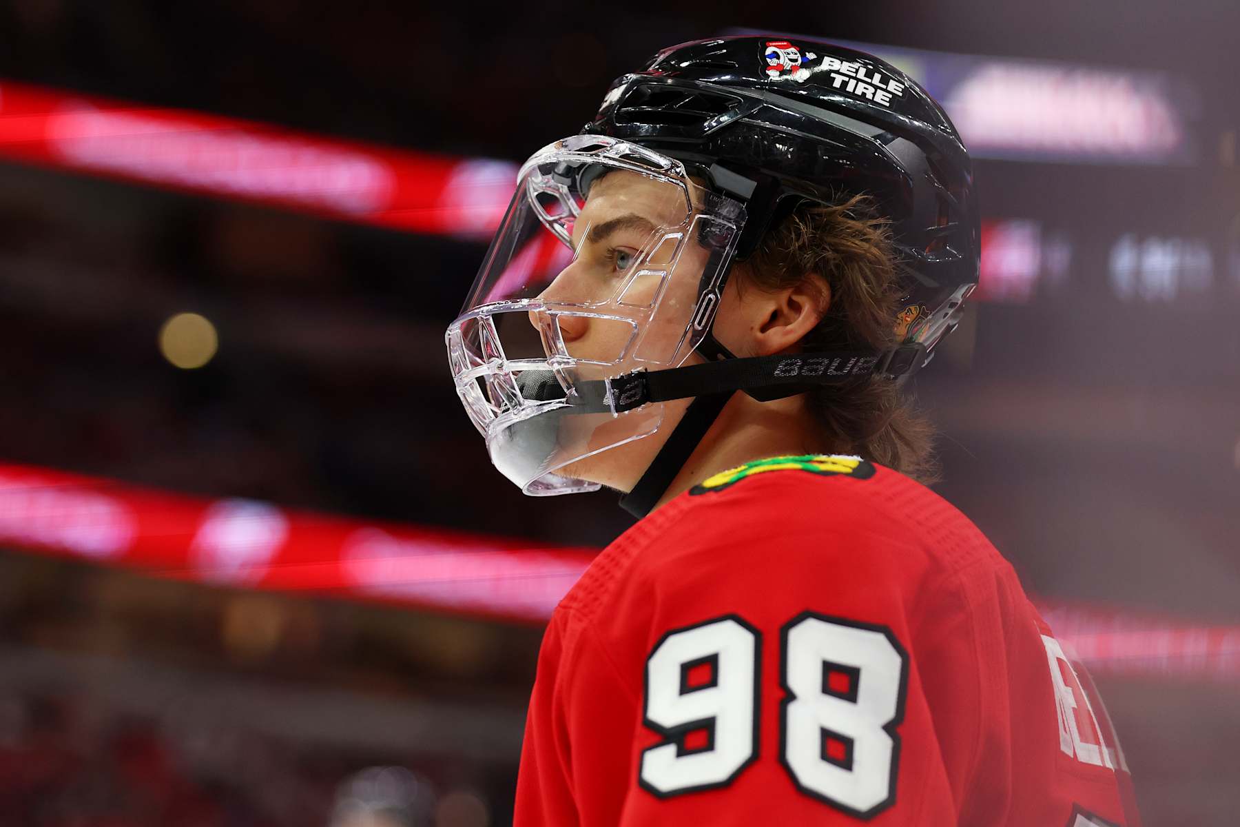 CHICAGO, ILLINOIS - APRIL 14: Connor Bedard #98 of the Chicago Blackhawks looks on against the Carolina Hurricanes during the first period at the United Center on April 14, 2024 in Chicago, Illinois. (Photo by Michael Reaves/Getty Images)