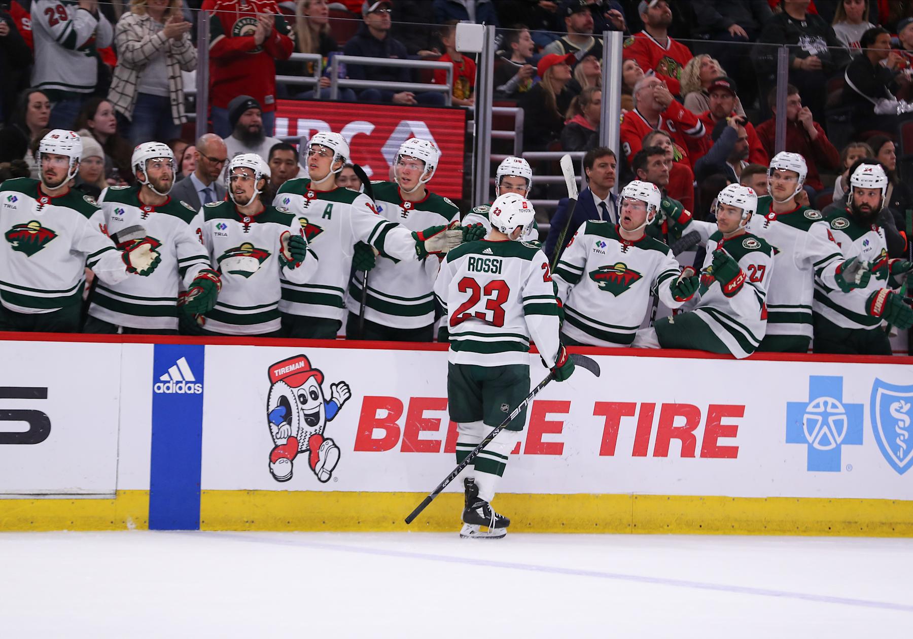 CHICAGO, IL - APRIL 07: Marco Rossi #23 of the Minnesota Wild celebrates with teammates on the bench after scoring a goal during the second period against the Chicago Blackhawks at the United Center on April, 7, 2024 in Chicago, Illinois. (Photo by Melissa Tamez/Icon Sportswire via Getty Images)