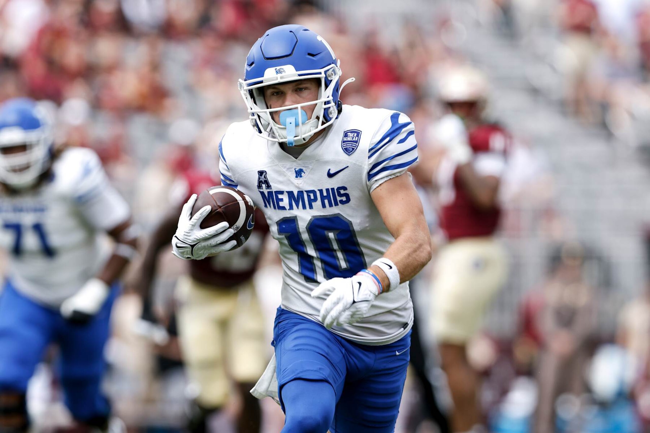 TALLAHASSEE, FL - SEPTEMBER 14: Wide Receiver Koby Drake #10 of the Memphis Tigers on a catch and run during the game against the Florida State Seminoles at Doak Campbell Stadium on Bobby Bowden Field on September 14, 2024 in Tallahassee, Florida. The Tigers defeated the Seminoles 20 to 12. (Photo by Don Juan Moore/Getty Images)
