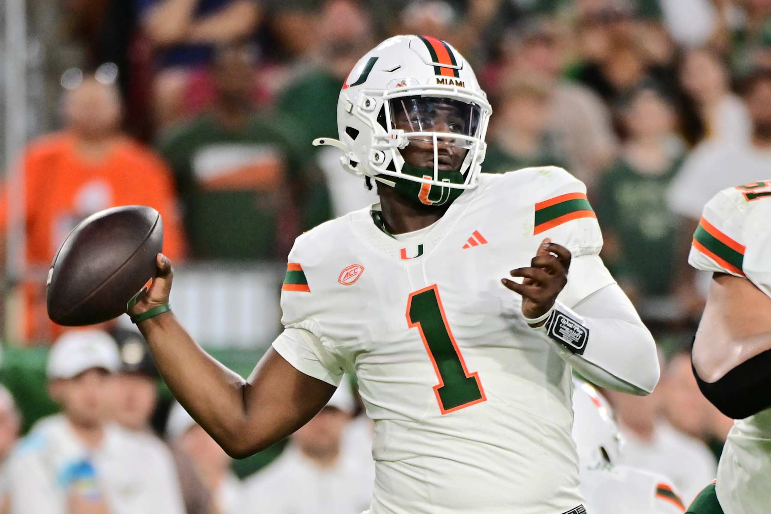 TAMPA, FLORIDA - SEPTEMBER 21: Cam Ward #1 of the Miami Hurricanes drops back to throw a pass in the first quarter against the South Florida Bulls at Raymond James Stadium on September 21, 2024 in Tampa, Florida. (Photo by Julio Aguilar/Getty Images) TAMPA, FLORIDA - SEPTEMBER 21: Cam Ward #1 of the Miami Hurricanes drops back to throw a pass in the first quarter against the South Florida Bulls at Raymond James Stadium on September 21, 2024 in Tampa, Florida. (Photo by Julio Aguilar/Getty Images)
