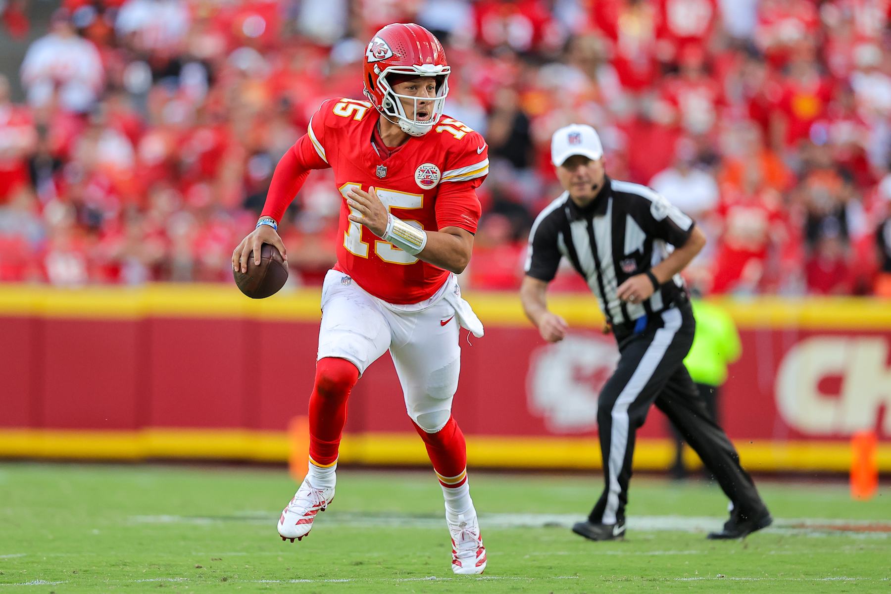 KANSAS CITY, MISSOURI - SEPTEMBER 15: Patrick Mahomes #15 of the Kansas City Chiefs runs for yardage during the third quarter against the Cincinnati Bengals at GEHA Field at Arrowhead Stadium on September 15, 2024 in Kansas City, Missouri. (Photo by David Eulitt/Getty Images)
