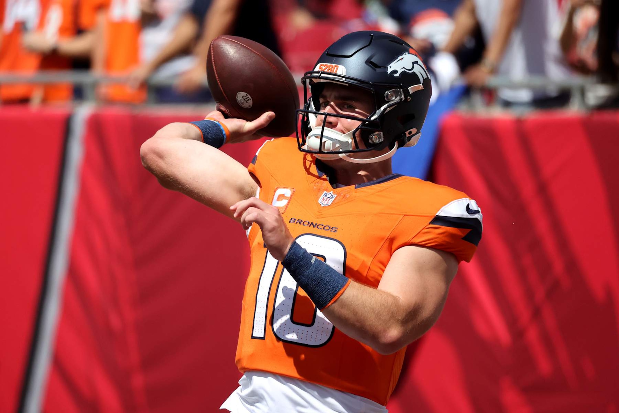 TAMPA, FLORIDA - SEPTEMBER 22: Quarterback Bo Nix #10 of the Denver Broncos throws a pass during pregame warm ups prior to playing the Tampa Bay Buccaneers at Raymond James Stadium on September 22, 2024 in Tampa, Florida. (Photo by Mike Carlson/Getty Images)