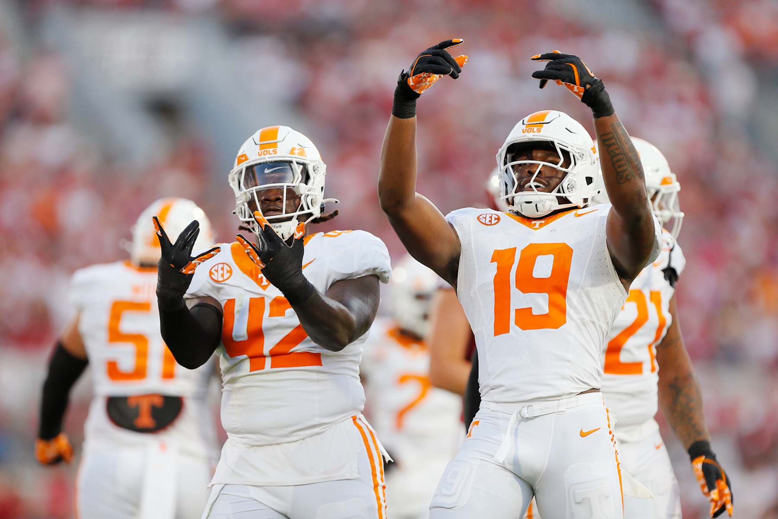 NORMAN, OKLAHOMA - SEPTEMBER 21:  Defensive lineman Tyre West #42 of the Tennessee Volunteers celebrates his sack on quarterback Jackson Arnold #11 of the Oklahoma Sooners with defensive lineman Joshua Josephs #19 in the first quarter at Gaylord Family Oklahoma Memorial Stadium on September 21, 2024 in Norman, Oklahoma.  (Photo by Brian Bahr/Getty Images)