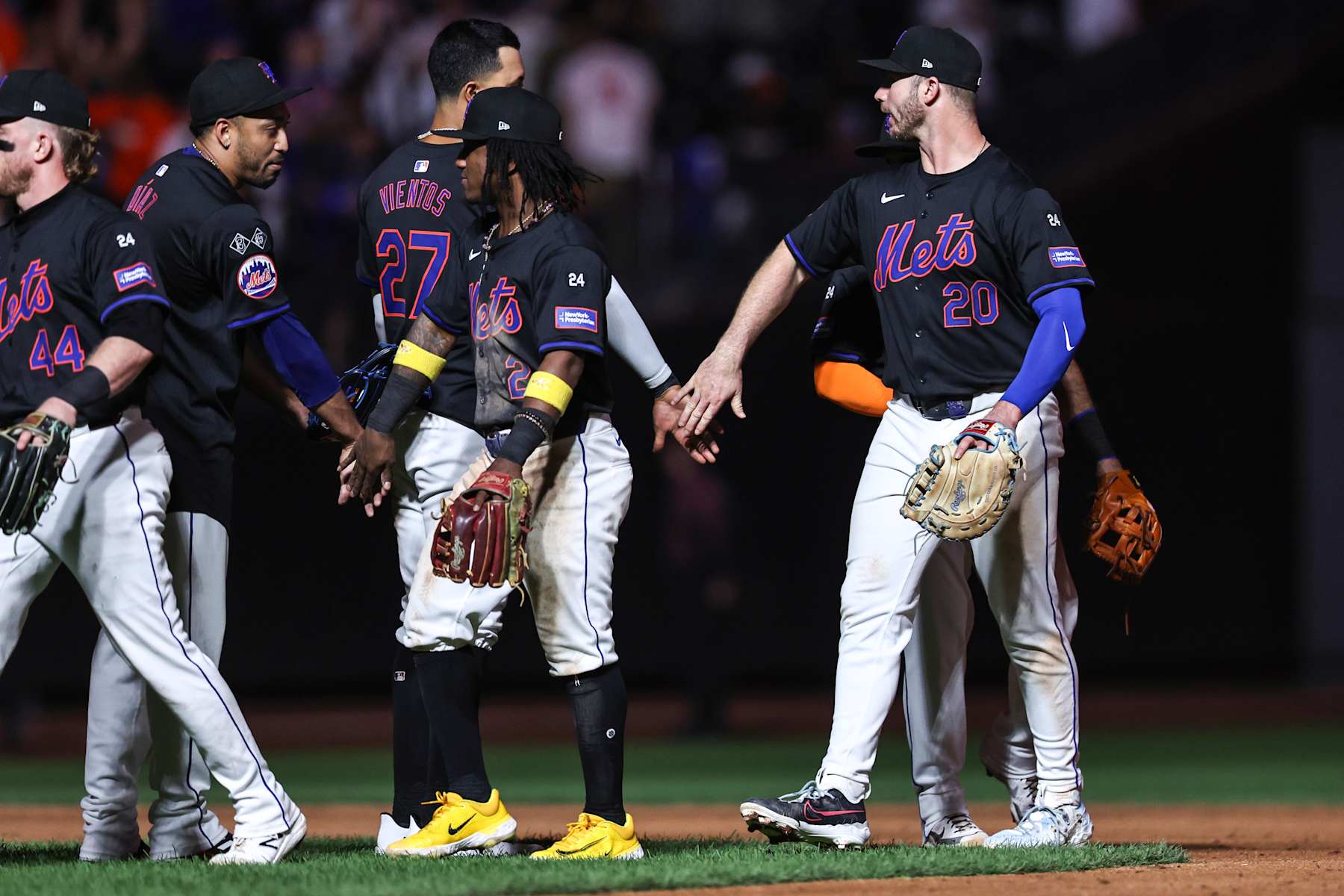 NEW YORK, NEW YORK - SEPTEMBER 19: Luisangel Acuña #2 of the New York Mets and Pete Alonso #20 of the New York Mets celebrate after defeating the Philadelphia Phillies 10-6 in the game at Citi Field on September 19, 2024 in New York City. (Photo by Dustin Satloff/Getty Images)