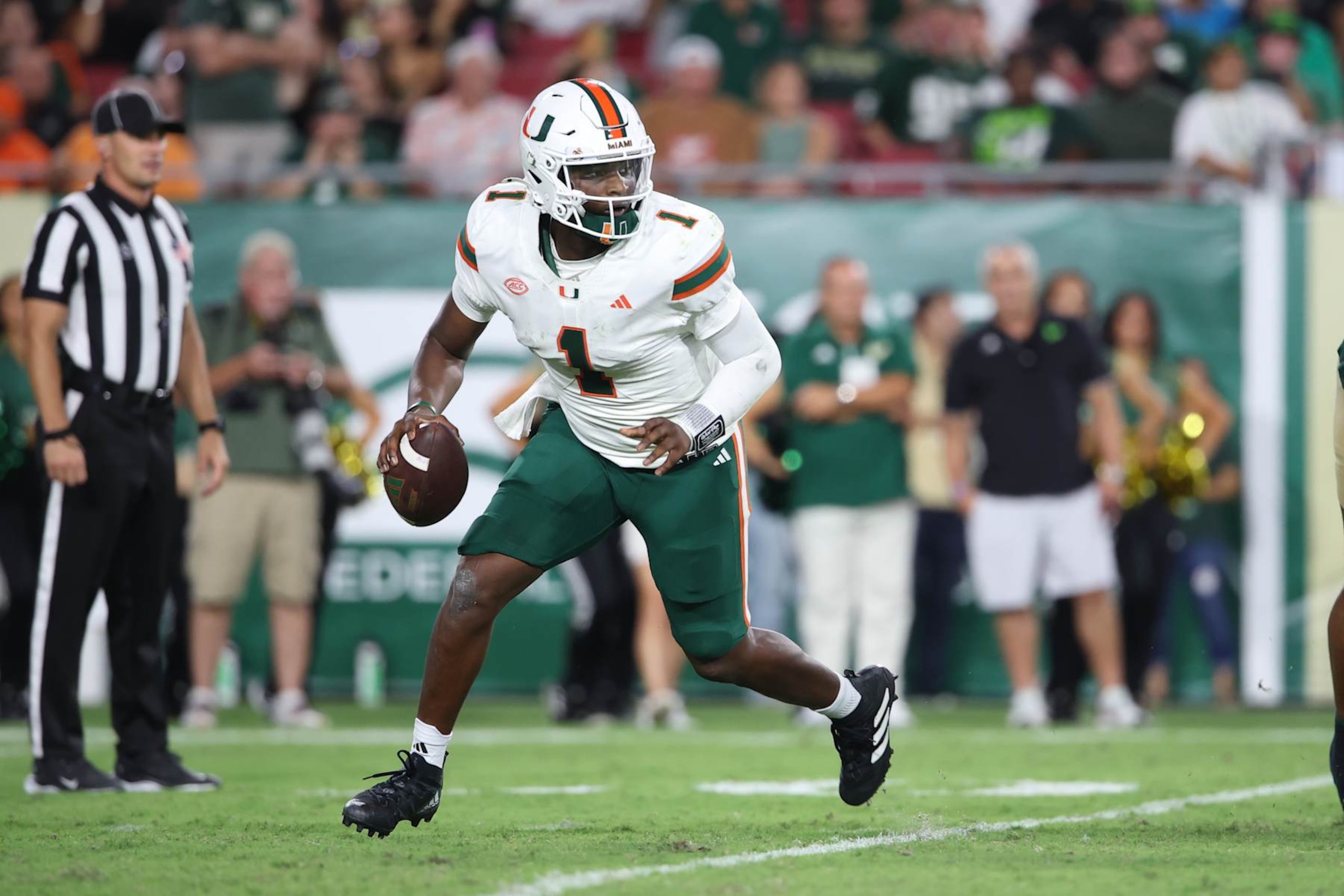 TAMPA, FL - SEPTEMBER 21: Miami Hurricanes quarterback Cam Ward (1) scrambles for time during the game between the University of Miami Hurricanes and the South Florida Bulls on Saturday, September 21, 2024 at Raymond James Stadium in Tampa, Fla. (Photo by Peter Joneleit/Icon Sportswire via Getty Images)
