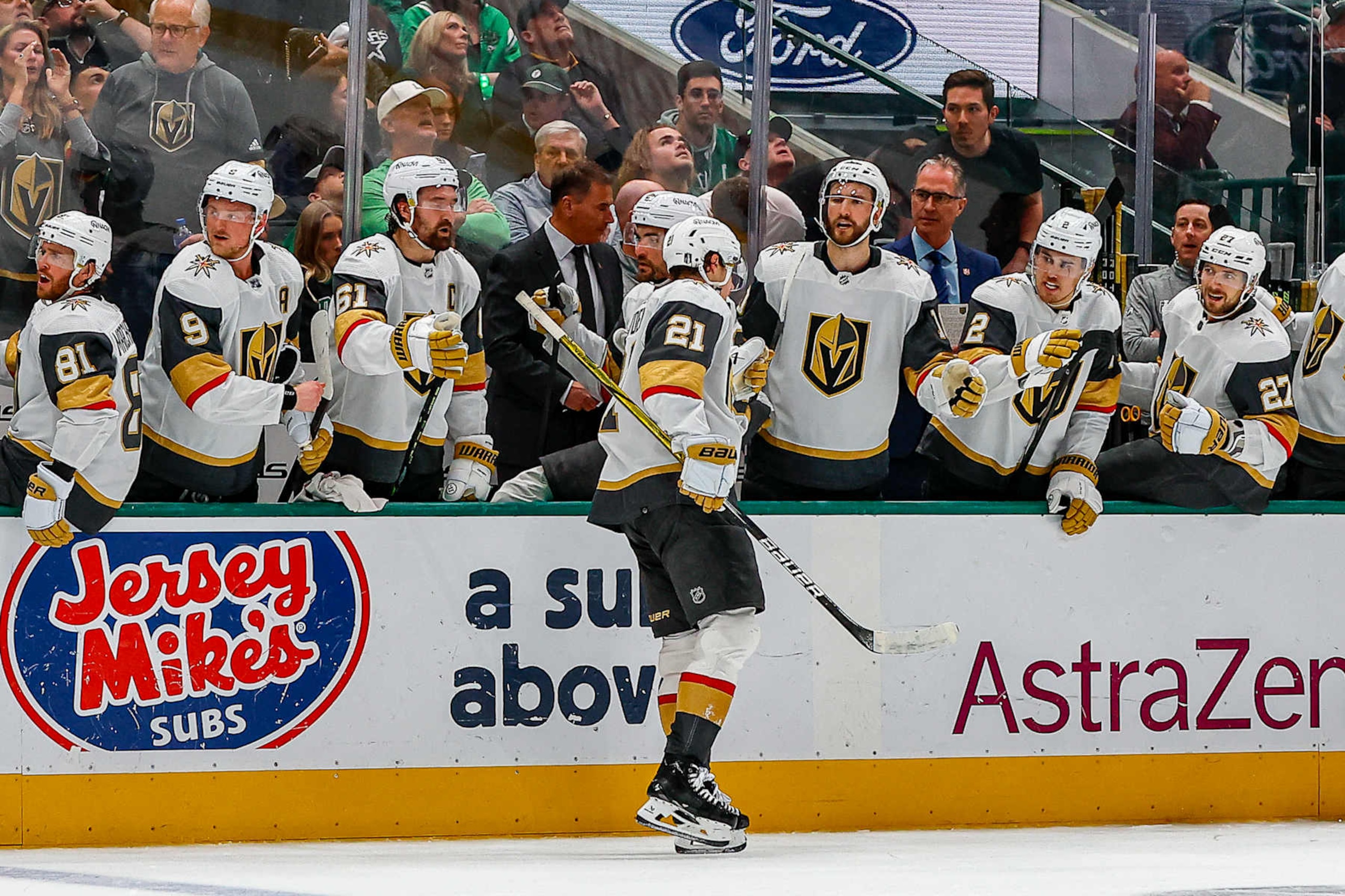 DALLAS, TX - MAY 05: Vegas Golden Knights center Brett Howden (21) gets high fives from his teammates after scoring a goal during game seven of the Western Conference First Round between the Dallas Stars and the Vegas Golden Knights on May 5, 2024 at American Airlines Center in Dallas, Texas. (Photo by Matthew Pearce/Icon Sportswire via Getty Images)