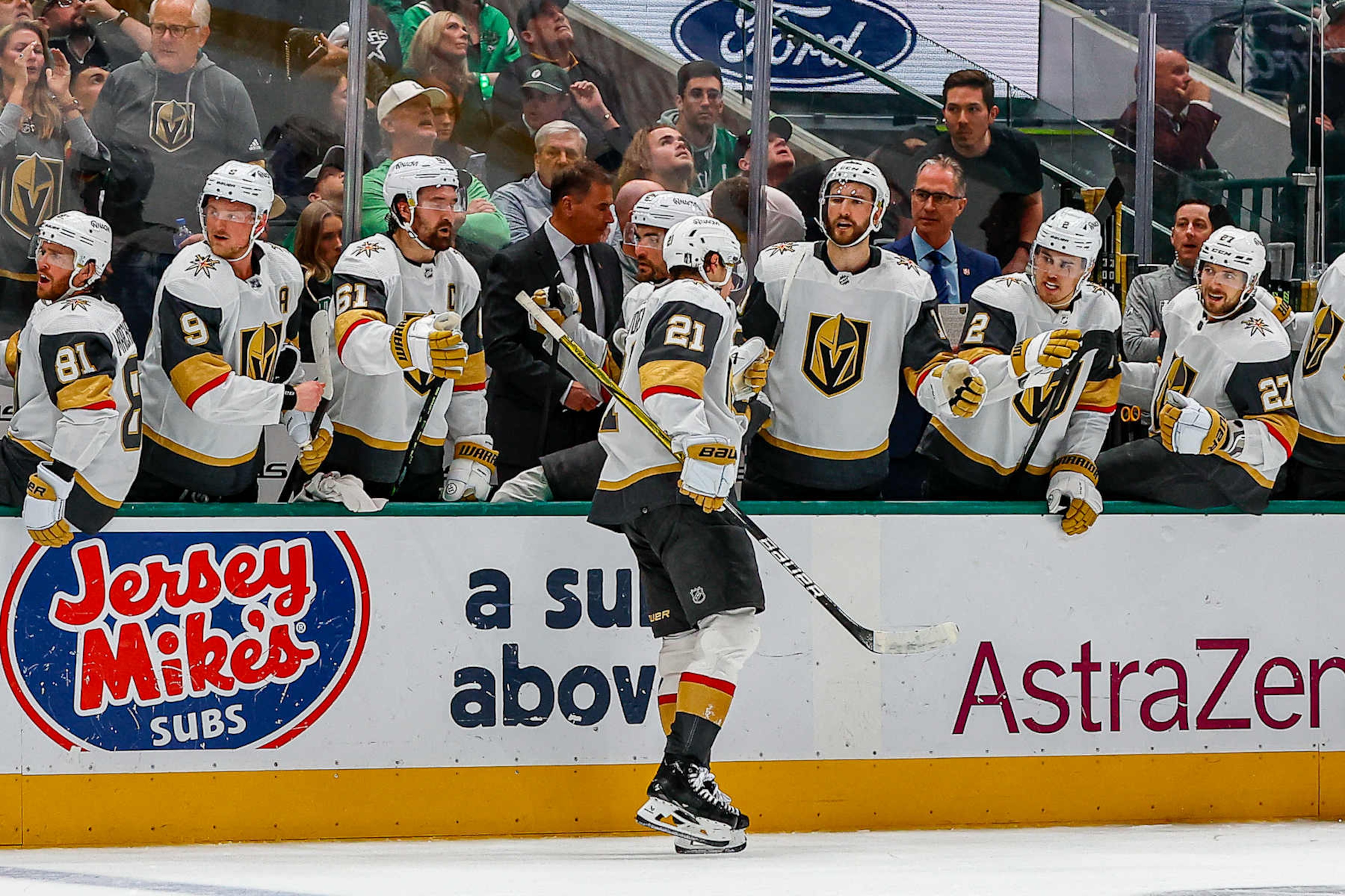 DALLAS, TX - MAY 05: Vegas Golden Knights center Brett Howden (21) gets high fives from his teammates after scoring a goal during game seven of the Western Conference First Round between the Dallas Stars and the Vegas Golden Knights on May 5, 2024 at American Airlines Center in Dallas, Texas. (Photo by Matthew Pearce/Icon Sportswire via Getty Images)