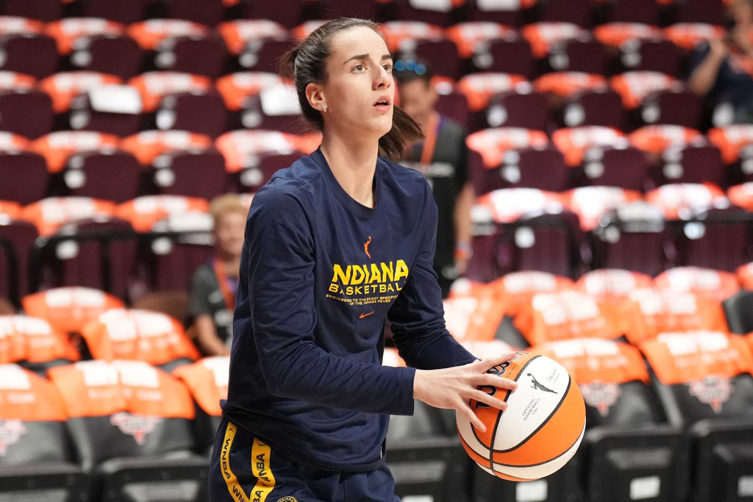 UNCASVILLE, CT - SEPTEMBER 22: Caitlin Clark #22 of the Indiana Fever warms up before the game against the Connecticut Sun during round one game one of the 2024 WNBA Playoffs on September 22, 2024 at the Mohegan Sun Arena in Uncasville, Connecticut. NOTE TO USER: User expressly acknowledges and agrees that, by downloading and or using this photograph, User is consenting to the terms and conditions of the Getty Images License Agreement. Mandatory Copyright Notice: Copyright 2024 NBAE (Photo by Jesse D. Garrabrant/NBAE via Getty Images)