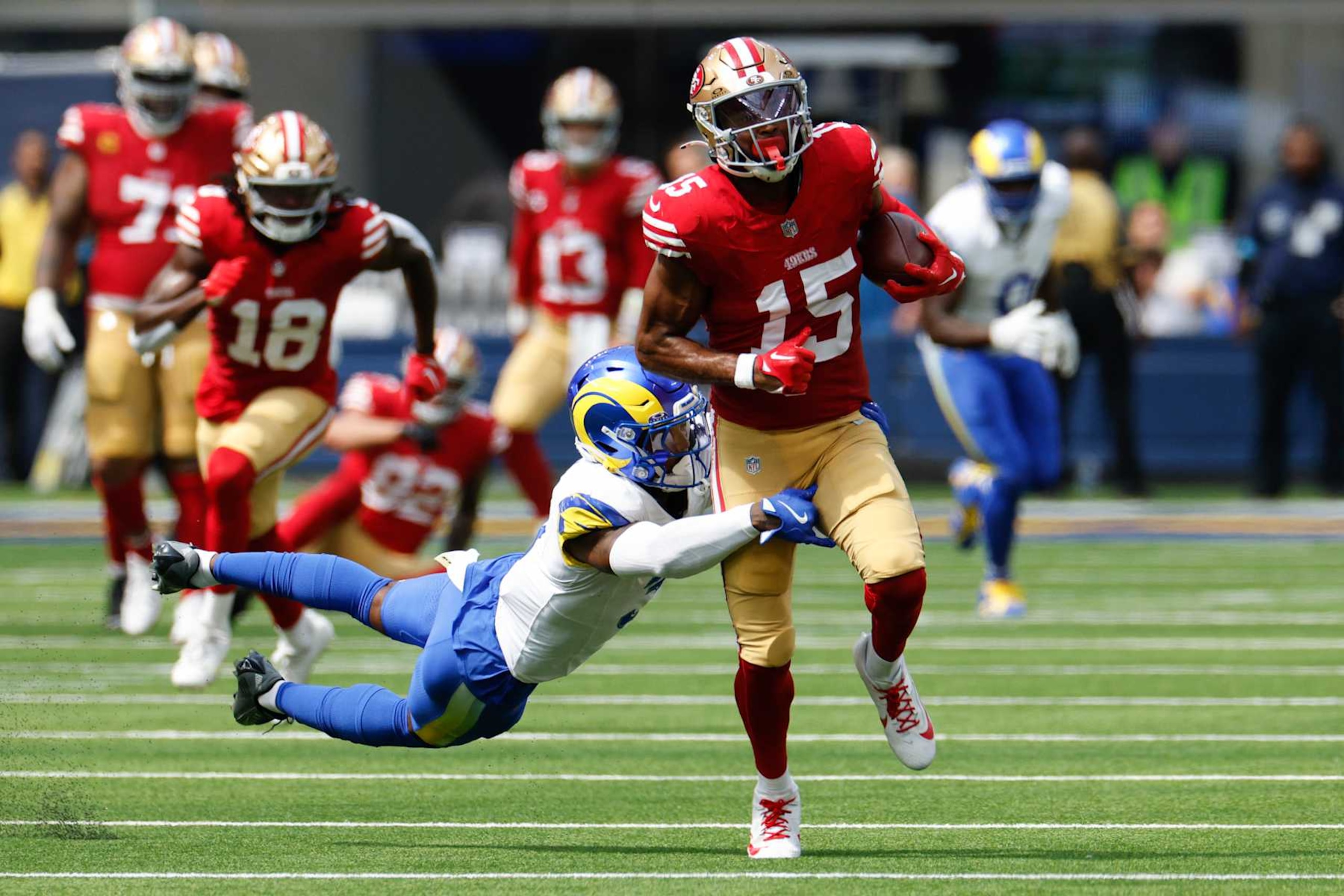 INGLEWOOD, CALIFORNIA - SEPTEMBER 22: Jauan Jennings #15 of the San Francisco 49ers is tackled by Kamren Curl #3 of the Los Angeles Rams during the first quarter at SoFi Stadium on September 22, 2024 in Inglewood, California. (Photo by Kevork Djansezian/Getty Images)
