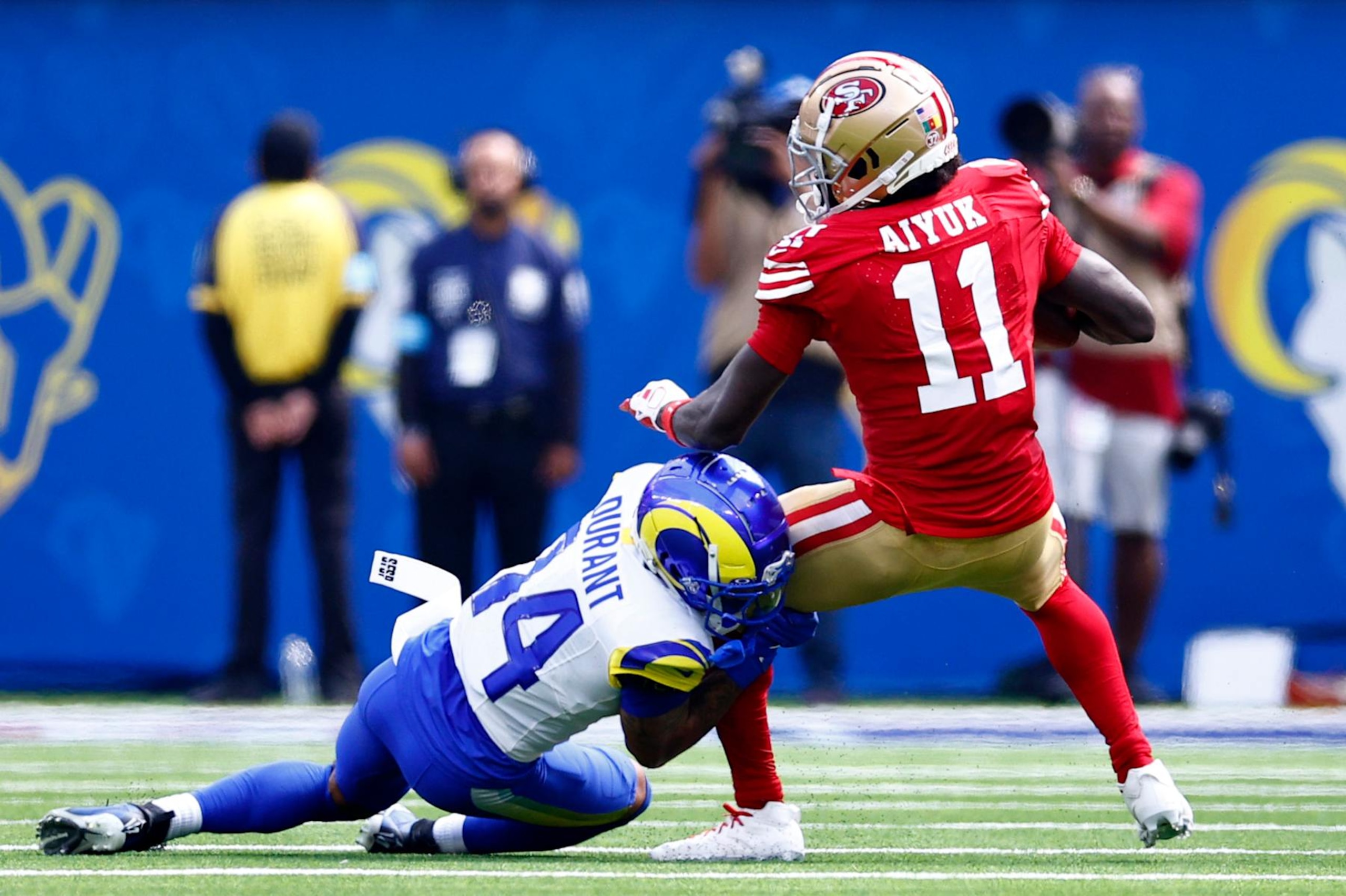 INGLEWOOD, CALIFORNIA - SEPTEMBER 22: Brandon Aiyuk #11 of the San Francisco 49ers is tackled by Cobie Durant #14 of the Los Angeles Rams during the first halfat SoFi Stadium on September 22, 2024 in Inglewood, California. (Photo by Ronald Martinez/Getty Images)