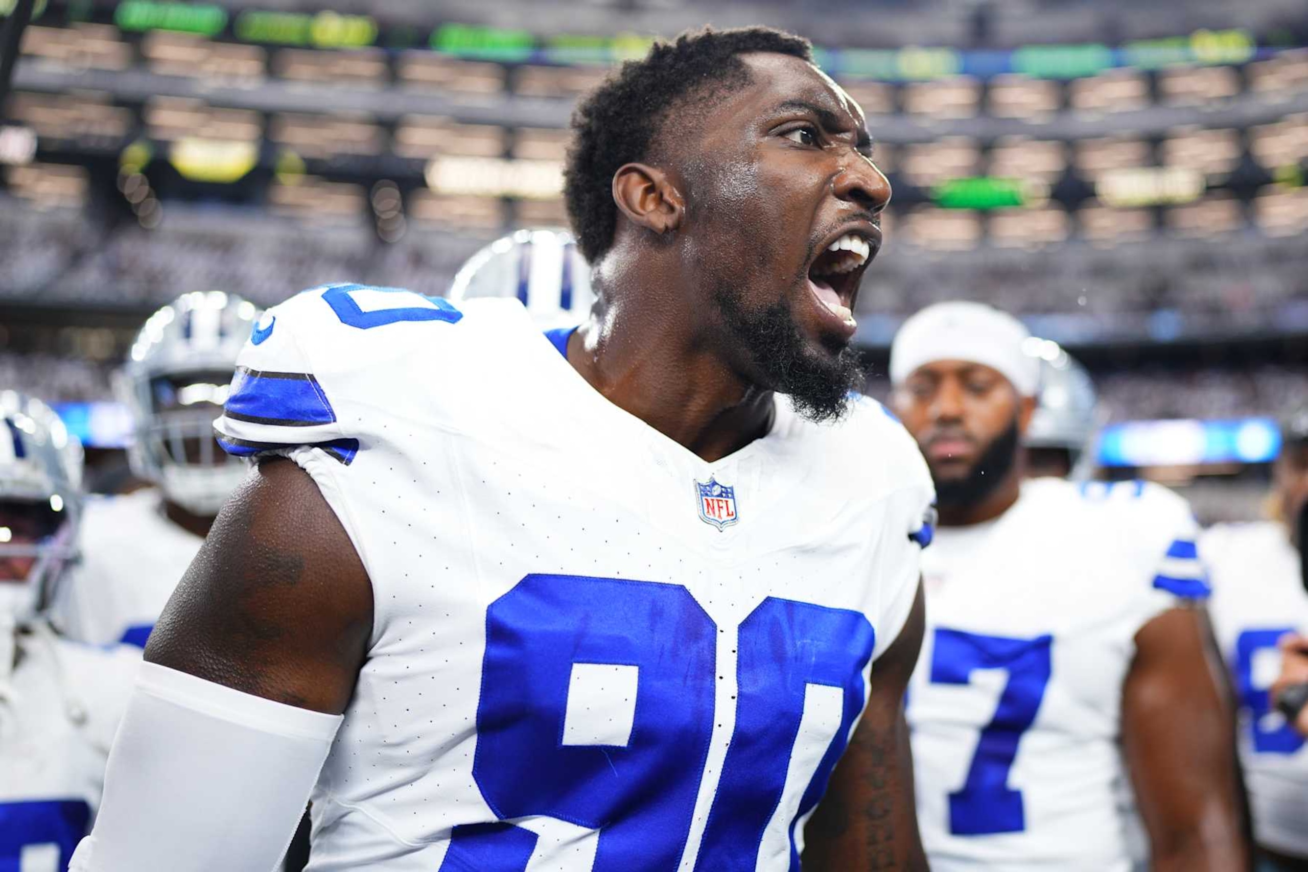 ARLINGTON, TX - SEPTEMBER 22: DeMarcus Lawrence #90 of the Dallas Cowboys speaks to teammates before kickoff against the Baltimore Ravens during an NFL football game at AT&T Stadium on September 22, 2024 in Arlington, Texas. (Photo by Cooper Neill/Getty Images)