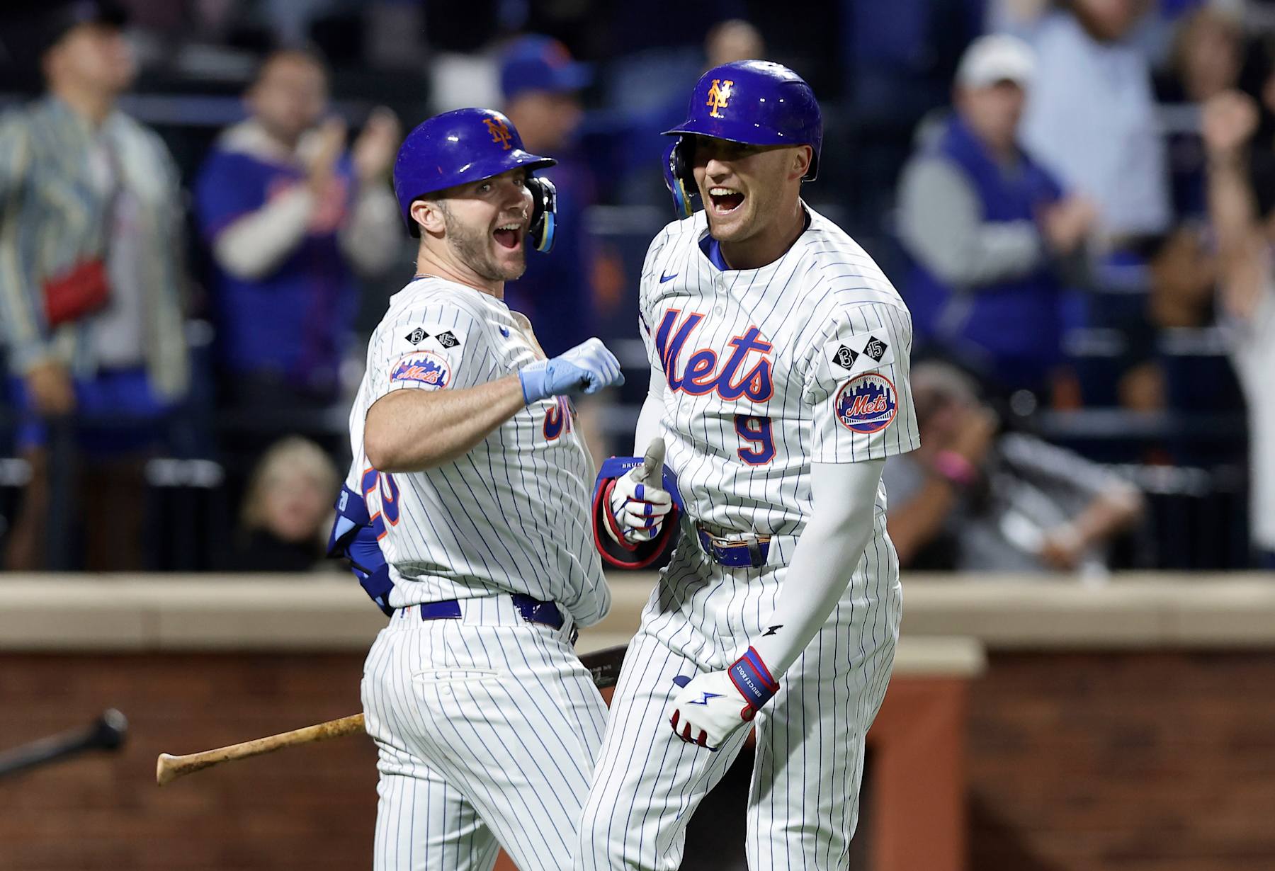 NEW YORK, NEW YORK - SEPTEMBER 22:  Brandon Nimmo #9 of the New York Mets celebrates his sixth inning home run against the Philadelphia Phillies with teammate Pete Alonso #20 at Citi Field on September 22, 2024 in New York City. (Photo by Jim McIsaac/Getty Images)