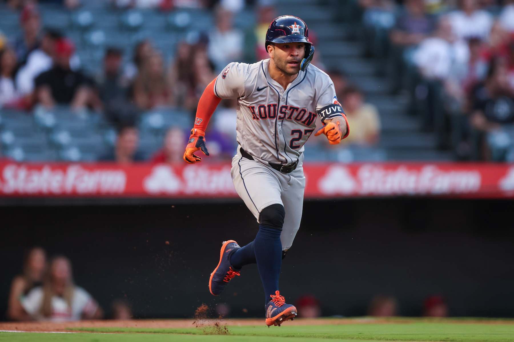 ANAHEIM, CALIFORNIA - SEPTEMBER 14: Jose Altuve #27 of the Houston Astros singles on a bunt in the first inning against the Los Angeles Angels at Angel Stadium of Anaheim on September 14, 2024 in Anaheim, California. (Photo by Meg Oliphant/Getty Images)
