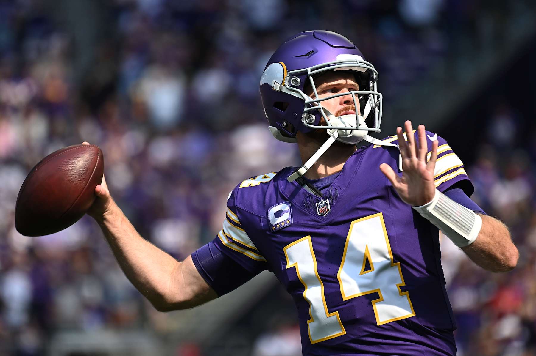 MINNEAPOLIS, MINNESOTA - SEPTEMBER 22: Quarterback Sam Darnold #14 of the Minnesota Vikings passes the ball against the Houston Texans during the first quarter at U.S. Bank Stadium on September 22, 2024 in Minneapolis, Minnesota. (Photo by Stephen Maturen/Getty Images)