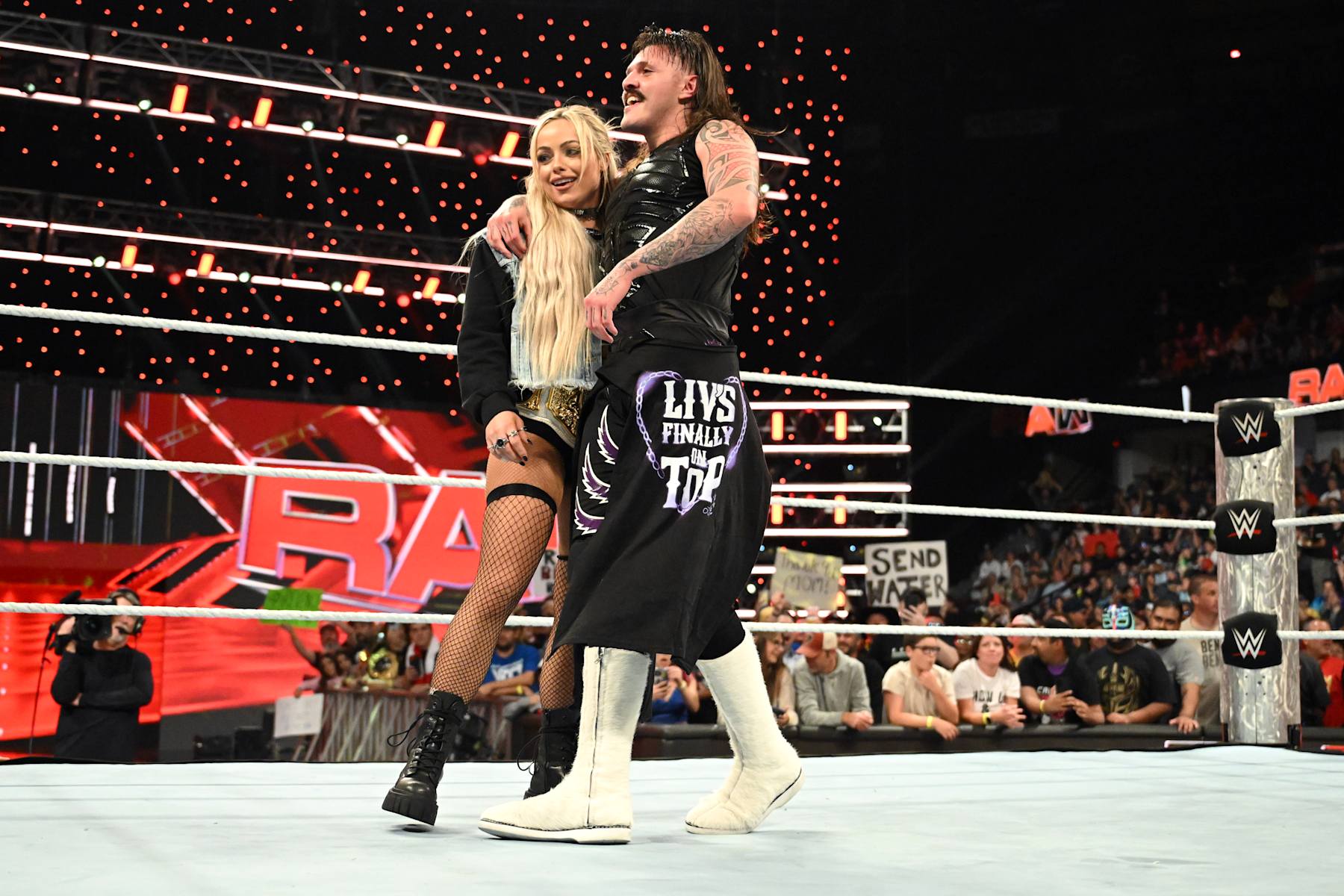 CALGARY, CANADA - SEPTEMBER 09: Liv Morgan and Dominik Mysterio celebrate after Dominik's win over Dragon Lee during Monday Night RAW at the Scotiabank Saddledome on September 9, 2024 in Calgary, Canada.  (Photo by WWE/Getty Images)
