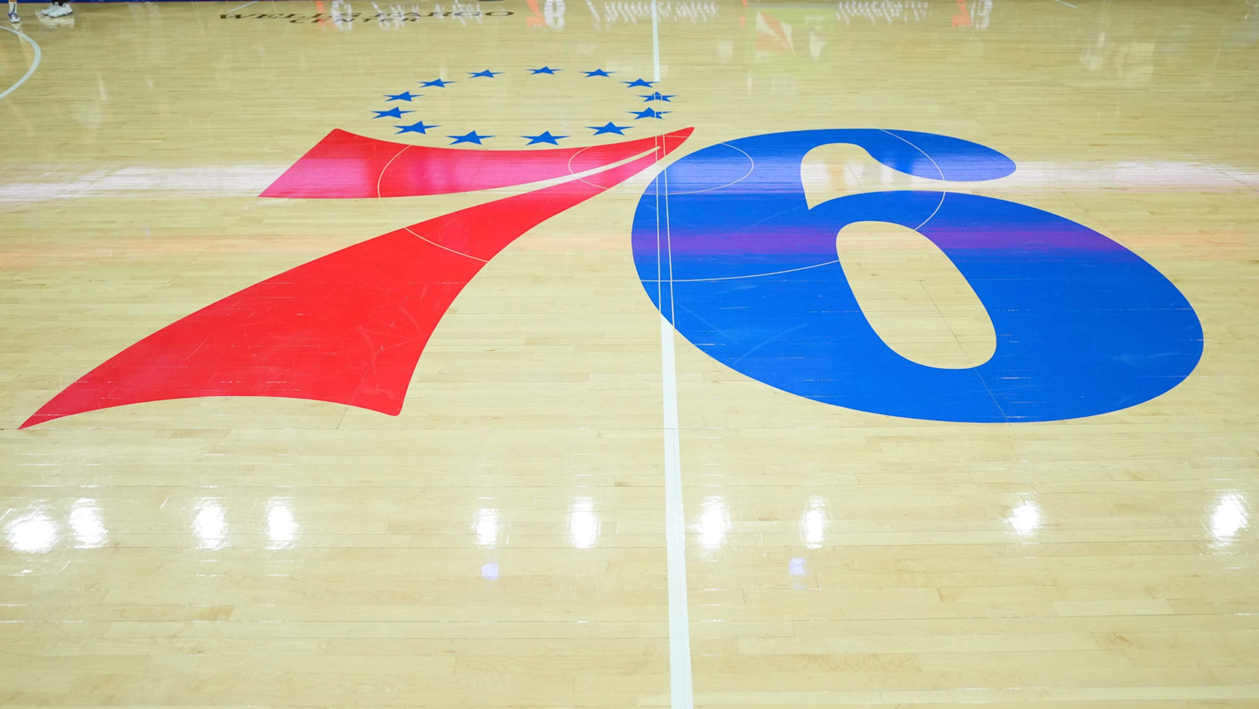 PHILADELPHIA, PA - NOVEMBER 18: A general view of the Philadelphia 76ers logo at center court prior to the game against the Milwaukee Bucks at the Wells Fargo Center on November 18, 2022 in Philadelphia, Pennsylvania. NOTE TO USER: User expressly acknowledges and agrees that, by downloading and or using this photograph, User is consenting to the terms and conditions of the Getty Images License Agreement. (Photo by Mitchell Leff/Getty Images) PHILADELPHIA, PA - NOVEMBER 18: A general view of the Philadelphia 76ers logo at center court prior to the game against the Milwaukee Bucks at the Wells Fargo Center on November 18, 2022 in Philadelphia, Pennsylvania. NOTE TO USER: User expressly acknowledges and agrees that, by downloading and or using this photograph, User is consenting to the terms and conditions of the Getty Images License Agreement. (Photo by Mitchell Leff/Getty Images)