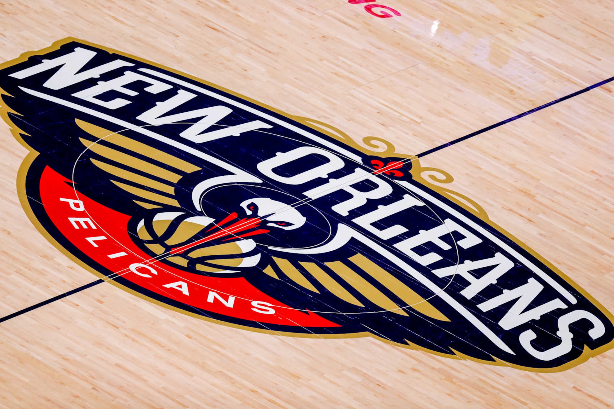 NEW ORLEANS, LA - NOV 17: General view of the New Orleans Pelicans logo at midcourt during a NBA game between the New Orleans Pelicans and the Golden State Warriors at Smoothie King Center in New Orleans, LA on Nov 17, 2019. (Photo by Stephen Lew/Icon Sportswire via Getty Images) NEW ORLEANS, LA - NOV 17: General view of the New Orleans Pelicans logo at midcourt during a NBA game between the New Orleans Pelicans and the Golden State Warriors at Smoothie King Center in New Orleans, LA on Nov 17, 2019. (Photo by Stephen Lew/Icon Sportswire via Getty Images)