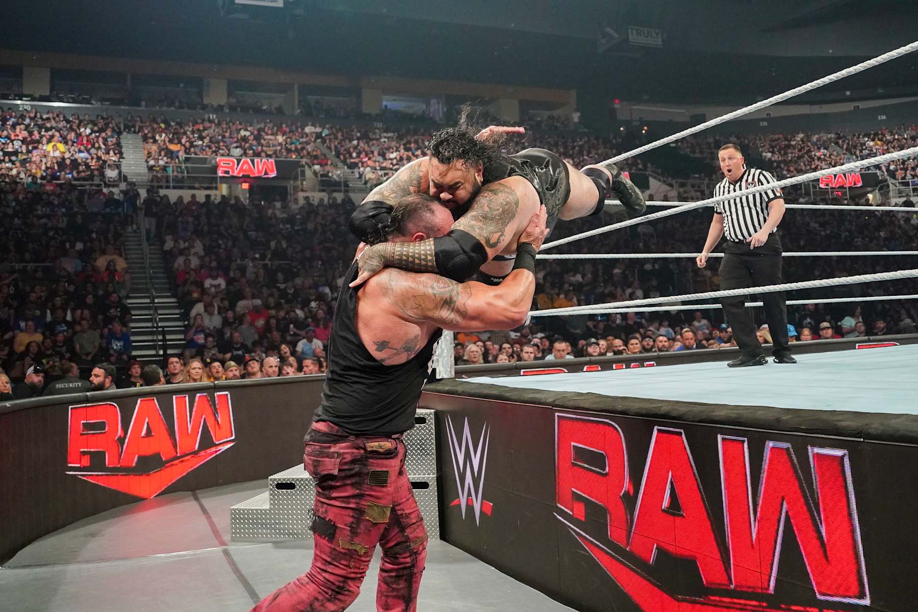 PROVIDENCE, RHODE ISLAND - AUGUST 26: Bronson Reed hits a suicide dive onto Braun Strowman during Monday Night RAW at Amica Mutual Pavillion on August 26, 2024 in Providence, Rhode Island.  (Photo by WWE/Getty Images)