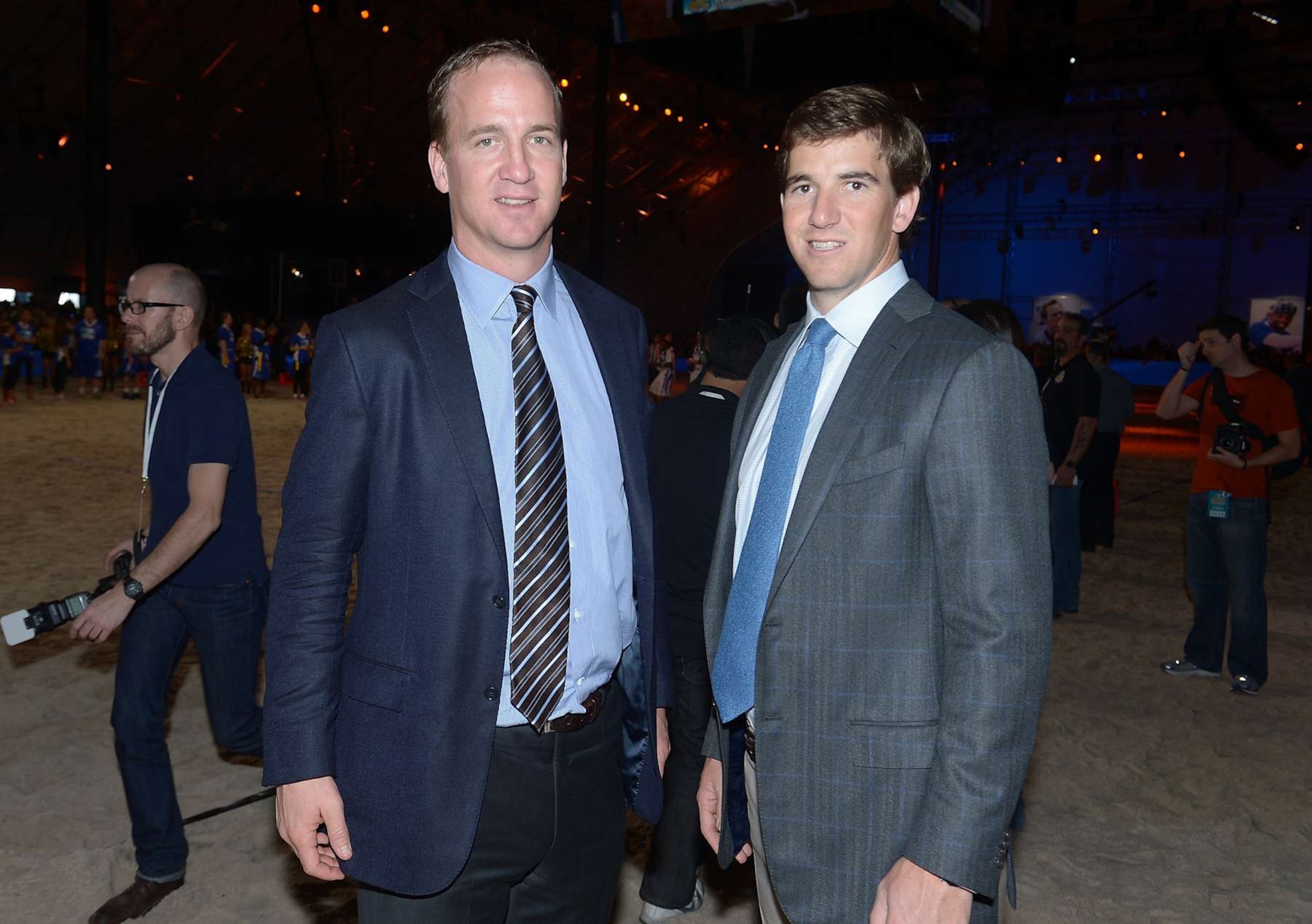 NEW ORLEANS, LA - FEBRUARY 02: Peyton Manning (L) and Eli Manning attend DIRECTV'S Seventh Annual Celebrity Beach Bowl at DTV SuperFan Stadium at Mardi Gras World on February 2, 2013 in New Orleans, Louisiana.  (Photo by Michael Loccisano/Getty Images For DirecTV)