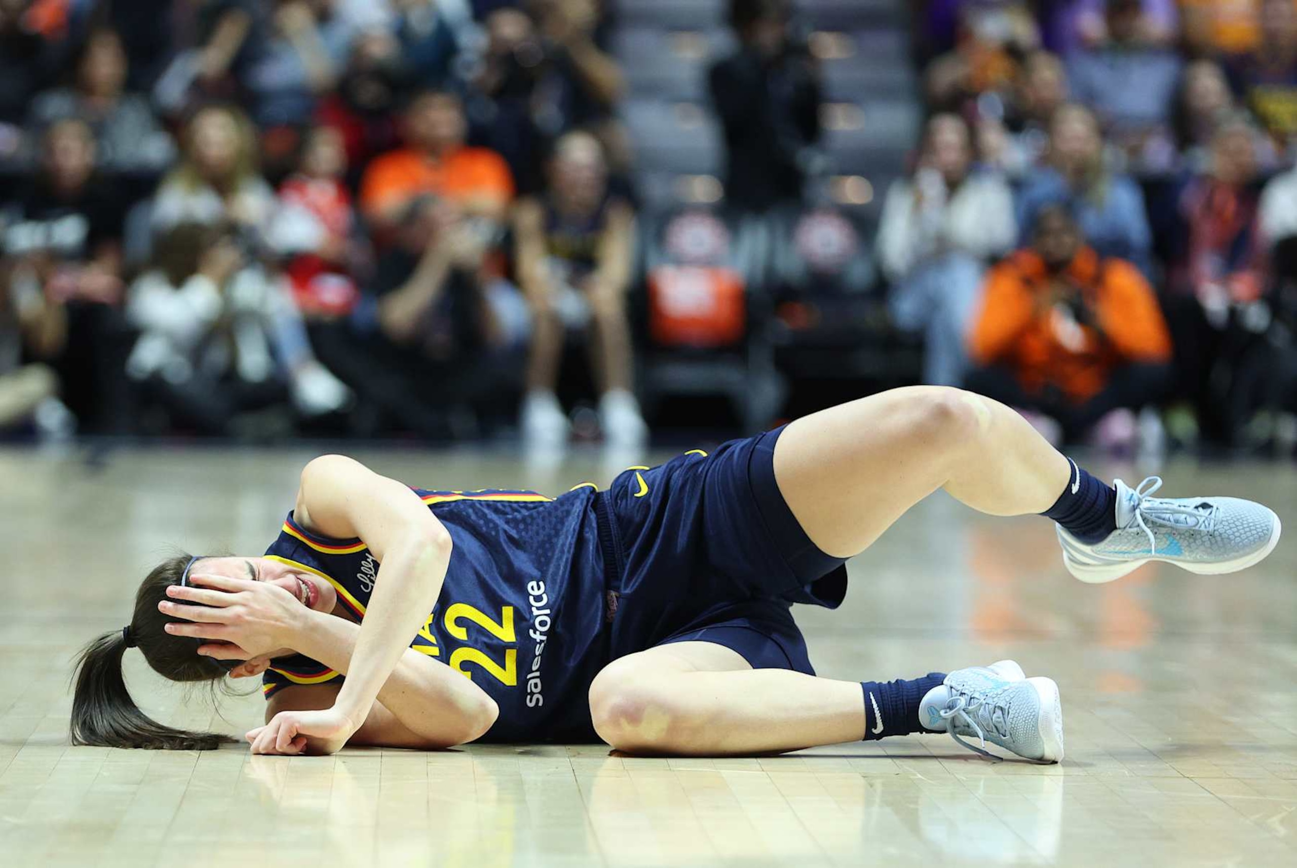 UNCASVILLE, CT - SEPTEMBER 22: Indiana Fever guard Caitlin Clark (22) reacts after getting hit in the eye during the First Round and game 1 of the 2024 WNBA playoffs between Indiana Fever and Connecticut Sun on September 22, 2024, at Mohegan Sun Arena in Uncasville, CT. (Photo by M. Anthony Nesmith/Icon Sportswire via Getty Images)