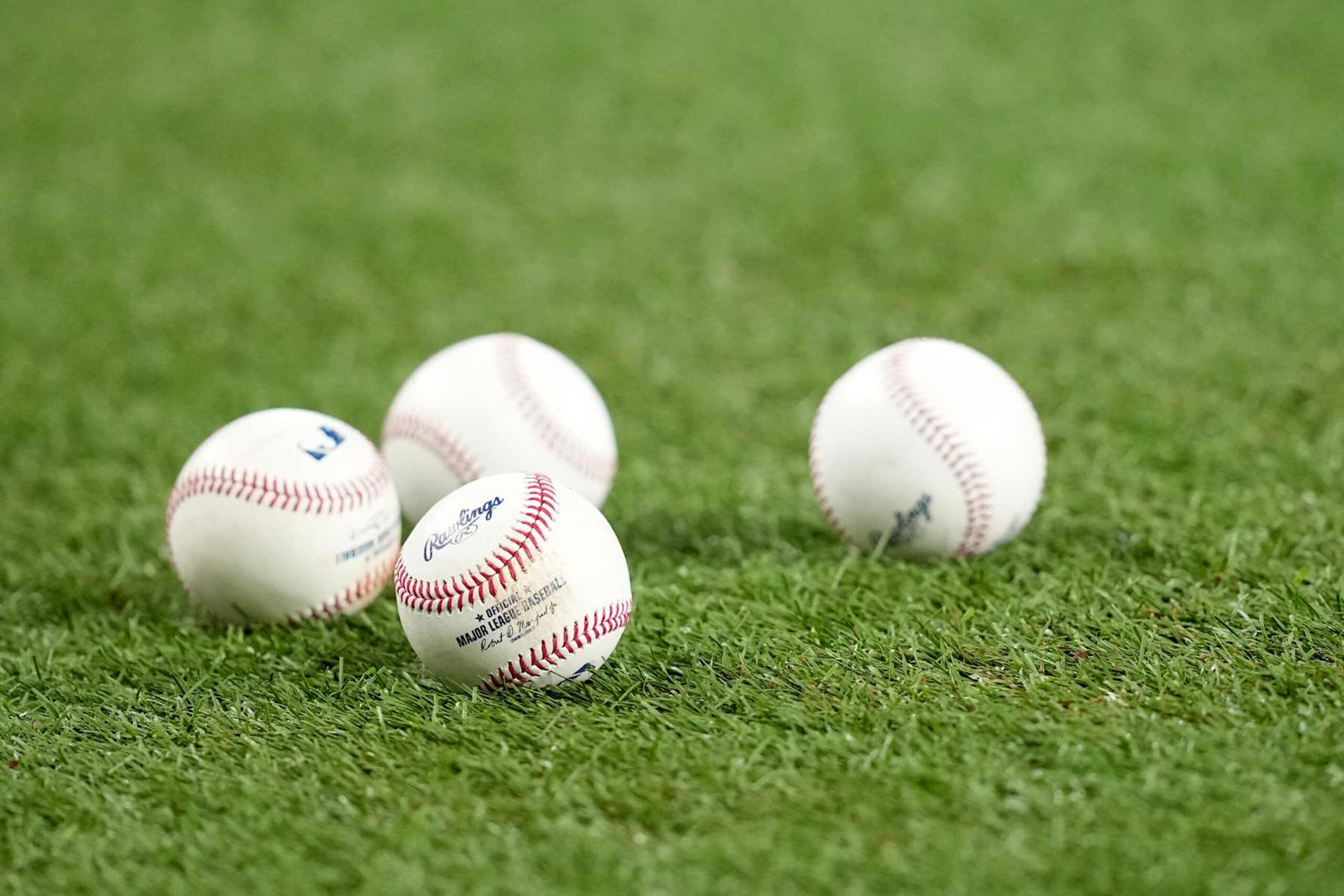 ARLINGTON, TEXAS - SEPTEMBER 17: A detail view of a group of baseballs sitting on the field is shown before the game between the Texas Rangers and the Toronto Blue Jays at Globe Life Field on September 17, 2024 in Arlington, Texas. (Photo by Sam Hodde/Getty Images)