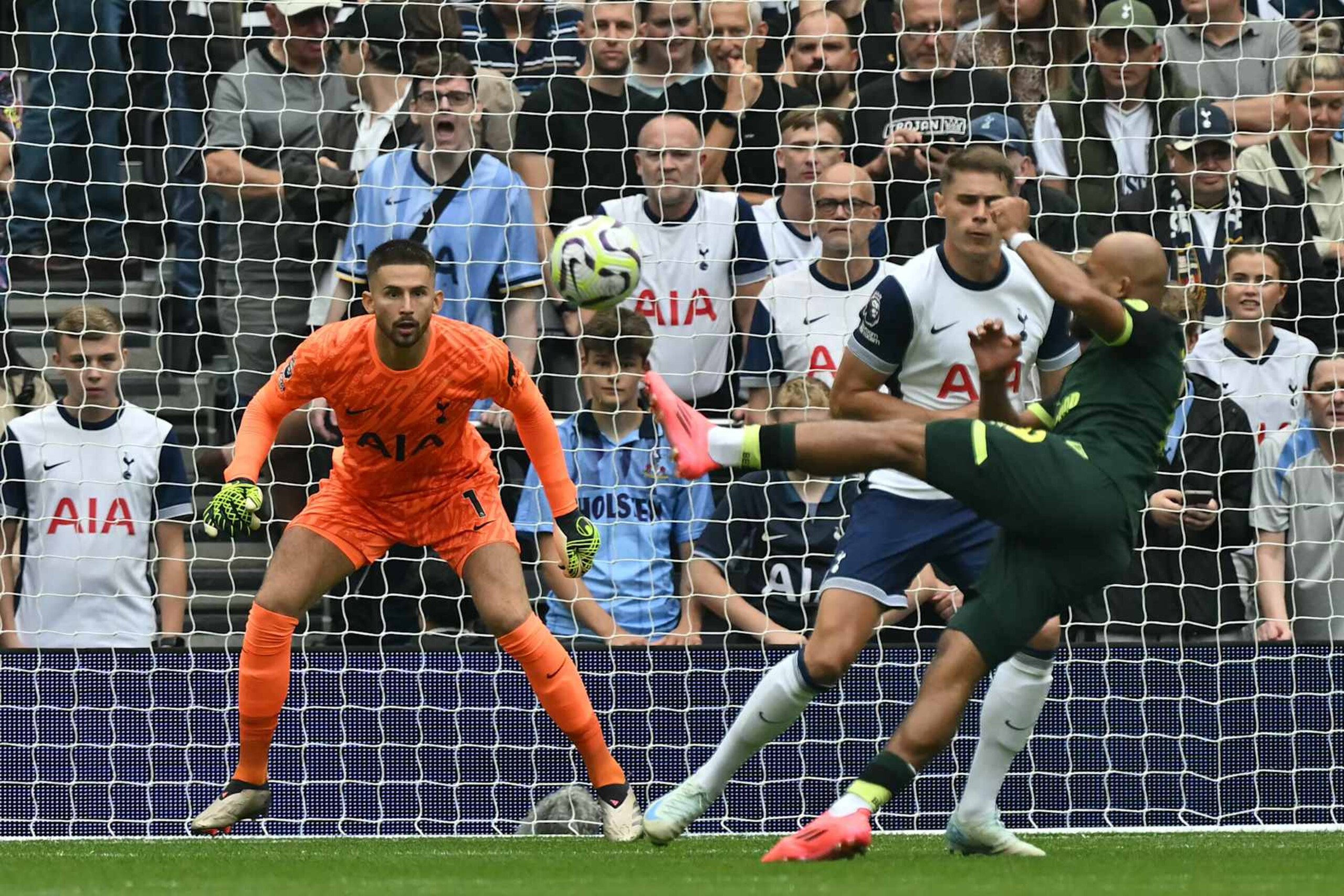 Brentford's French-born Cameroonian striker #19 Bryan Mbeumo shoots to score the opening goal of the English Premier League football match between Tottenham Hotspur and Brentford at the Tottenham Hotspur Stadium in London, on September 21, 2024. (Photo by Glyn KIRK / AFP) / RESTRICTED TO EDITORIAL USE. No use with unauthorized audio, video, data, fixture lists, club/league logos or 'live' services. Online in-match use limited to 120 images. An additional 40 images may be used in extra time. No video emulation. Social media in-match use limited to 120 images. An additional 40 images may be used in extra time. No use in betting publications, games or single club/league/player publications. /  (Photo by GLYN KIRK/AFP via Getty Images)