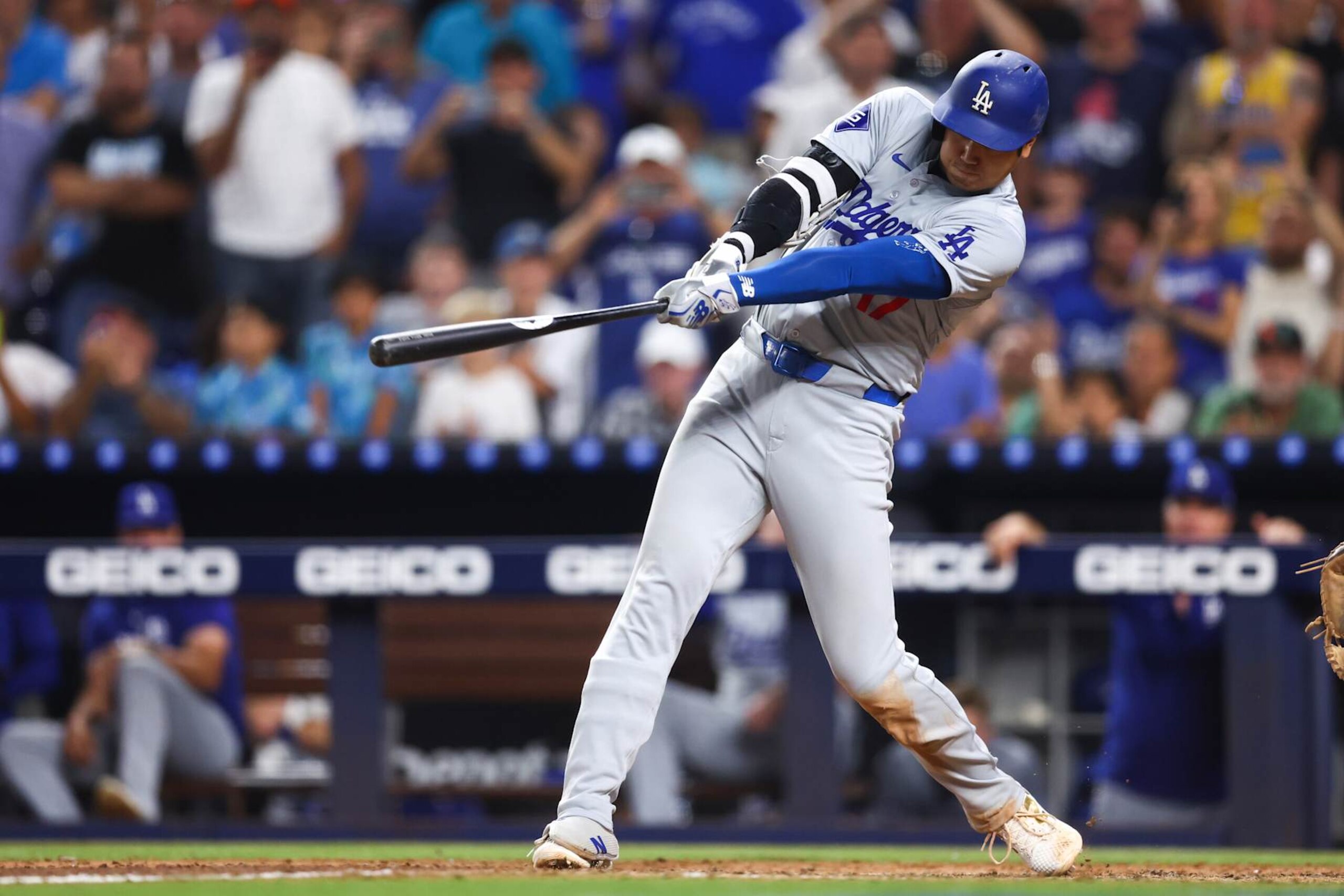 MIAMI, FLORIDA - SEPTEMBER 19: Shohei Ohtani #17 of the Los Angeles Dodgers hits a two-run home run, his 50th of the season, during the seventh inning against the Miami Marlins at loanDepot park on September 19, 2024 in Miami, Florida.  Ohtani is now the first MLB player to have at least 50 home runs and 50 stolen bases in the same season. (Photo by Megan Briggs/Getty Images)