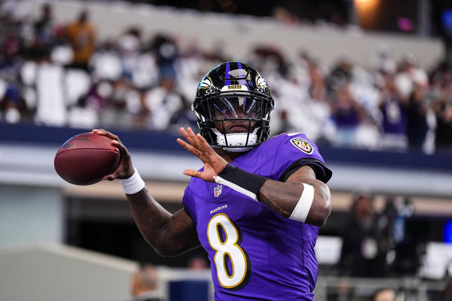 ARLINGTON, TX - SEPTEMBER 22: Lamar Jackson #8 of the Baltimore Ravens warms up prior to an NFL football game against the Dallas Cowboys at AT&T Stadium on September 22, 2024 in Arlington, Texas. (Photo by Cooper Neill/Getty Images) ARLINGTON, TX - SEPTEMBER 22: Lamar Jackson #8 of the Baltimore Ravens warms up prior to an NFL football game against the Dallas Cowboys at AT&T Stadium on September 22, 2024 in Arlington, Texas. (Photo by Cooper Neill/Getty Images)