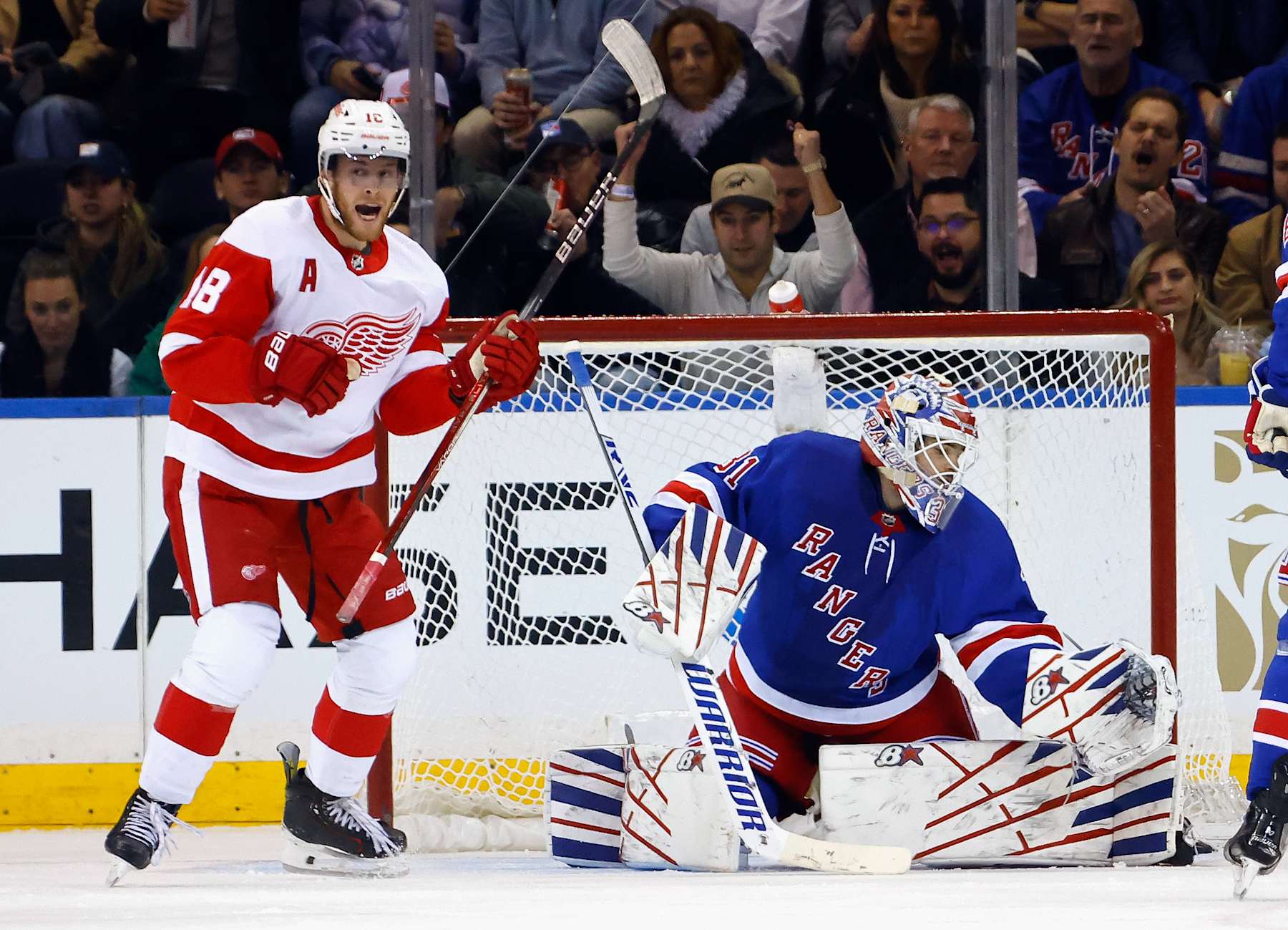 NEW YORK, NEW YORK - NOVEMBER 29: Andrew Copp #18 of the Detroit Red Wings celebrates a second period goal by Moritz Seider #53 against Igor Shesterkin #31 of the New York Rangers at Madison Square Garden on November 29, 2023 in New York City. (Photo by Bruce Bennett/Getty Images)