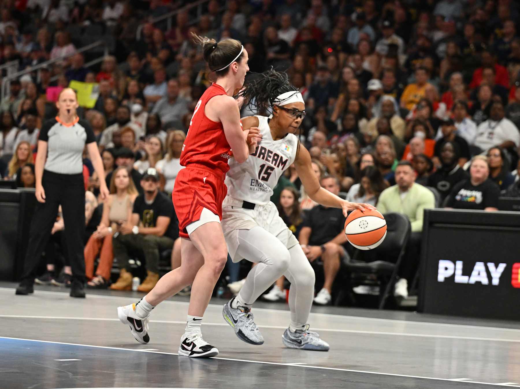 ATLANTA, GEORGIA - AUGUST 26: Allisha Gray #15 of the Atlanta Dream drives the ball as Caitlin Clark #22 of the Indiana Fever plays defense on August 26, 2024 at State Farm Arena in Atlanta, Georgia. NOTE TO USER: User expressly acknowledges and agrees that, by downloading and or using this photograph, User is consenting to the terms and conditions of the Getty Images License Agreement. (Photo by Paras Griffin/Getty Images)