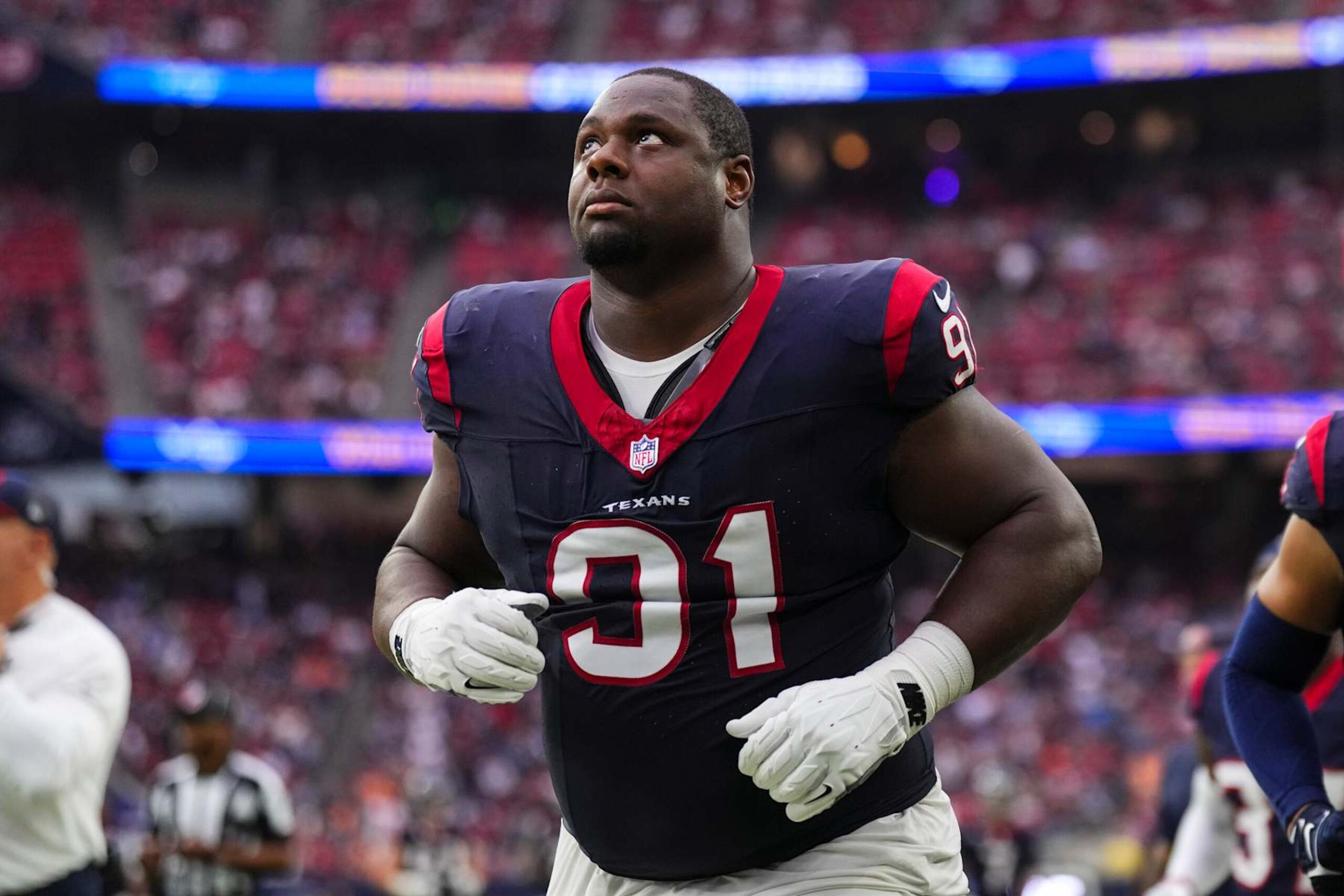 HOUSTON, TX - NOVEMBER 05: Hassan Ridgeway #91 of the Houston Texans runs off of the field during an NFL football game against the Tampa Bay Buccaneers at NRG Stadium on November 5, 2023 in Houston, Texas. (Photo by Cooper Neill/Getty Images)