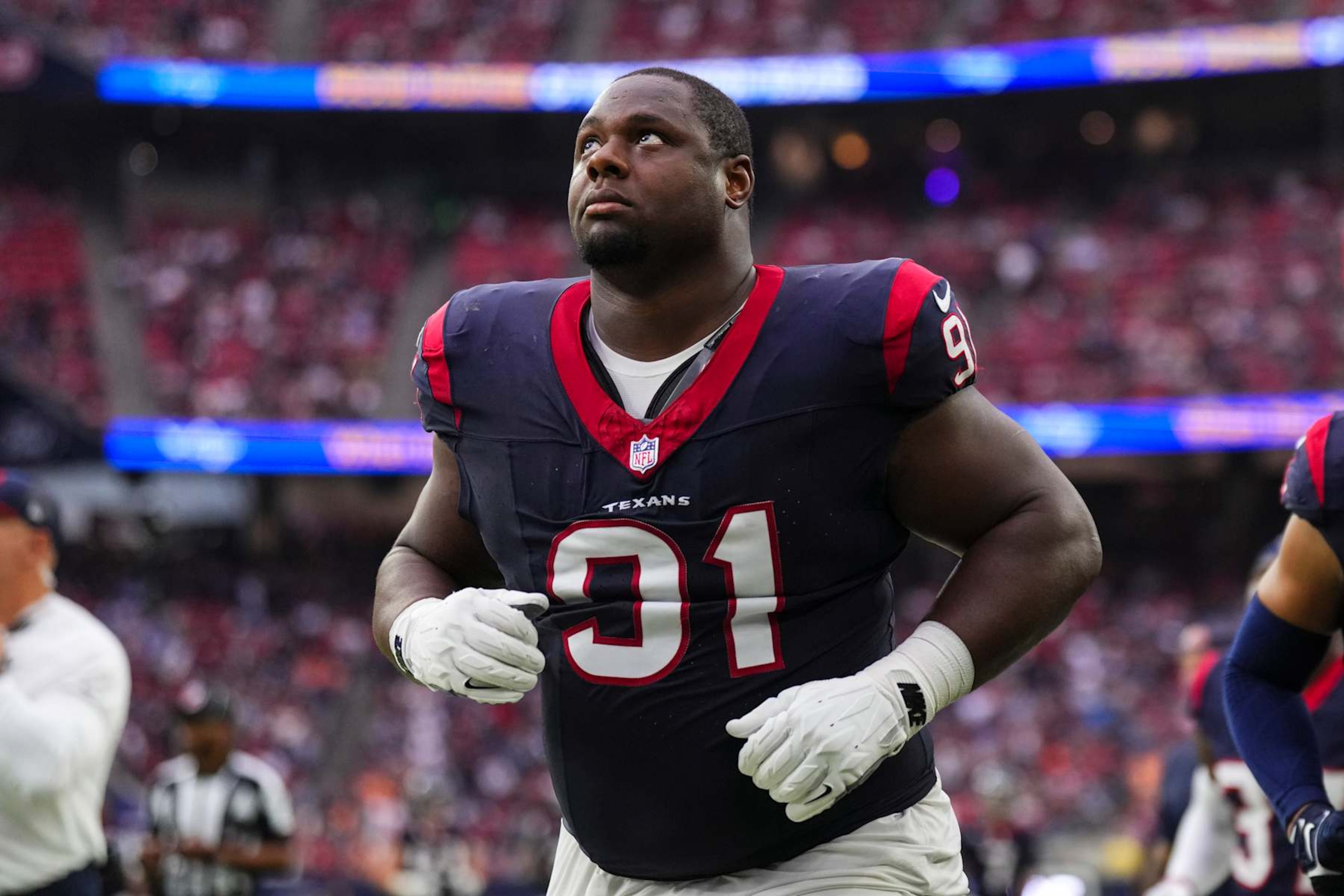 HOUSTON, TX - NOVEMBER 05: Hassan Ridgeway #91 of the Houston Texans runs off of the field during an NFL football game against the Tampa Bay Buccaneers at NRG Stadium on November 5, 2023 in Houston, Texas. (Photo by Cooper Neill/Getty Images)