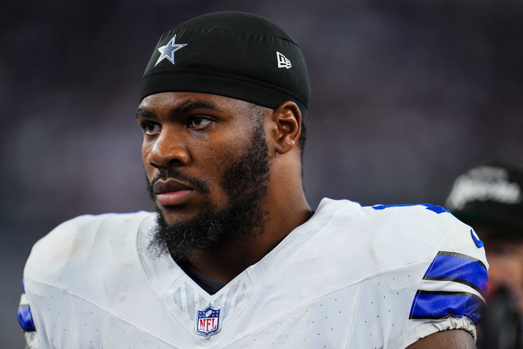 ARLINGTON, TX - SEPTEMBER 22: Micah Parsons #11 of the Dallas Cowboys looks on from the sideline prior to an NFL football game against the Baltimore Ravens at AT&T Stadium on September 22, 2024 in Arlington, Texas. (Photo by Cooper Neill/Getty Images)