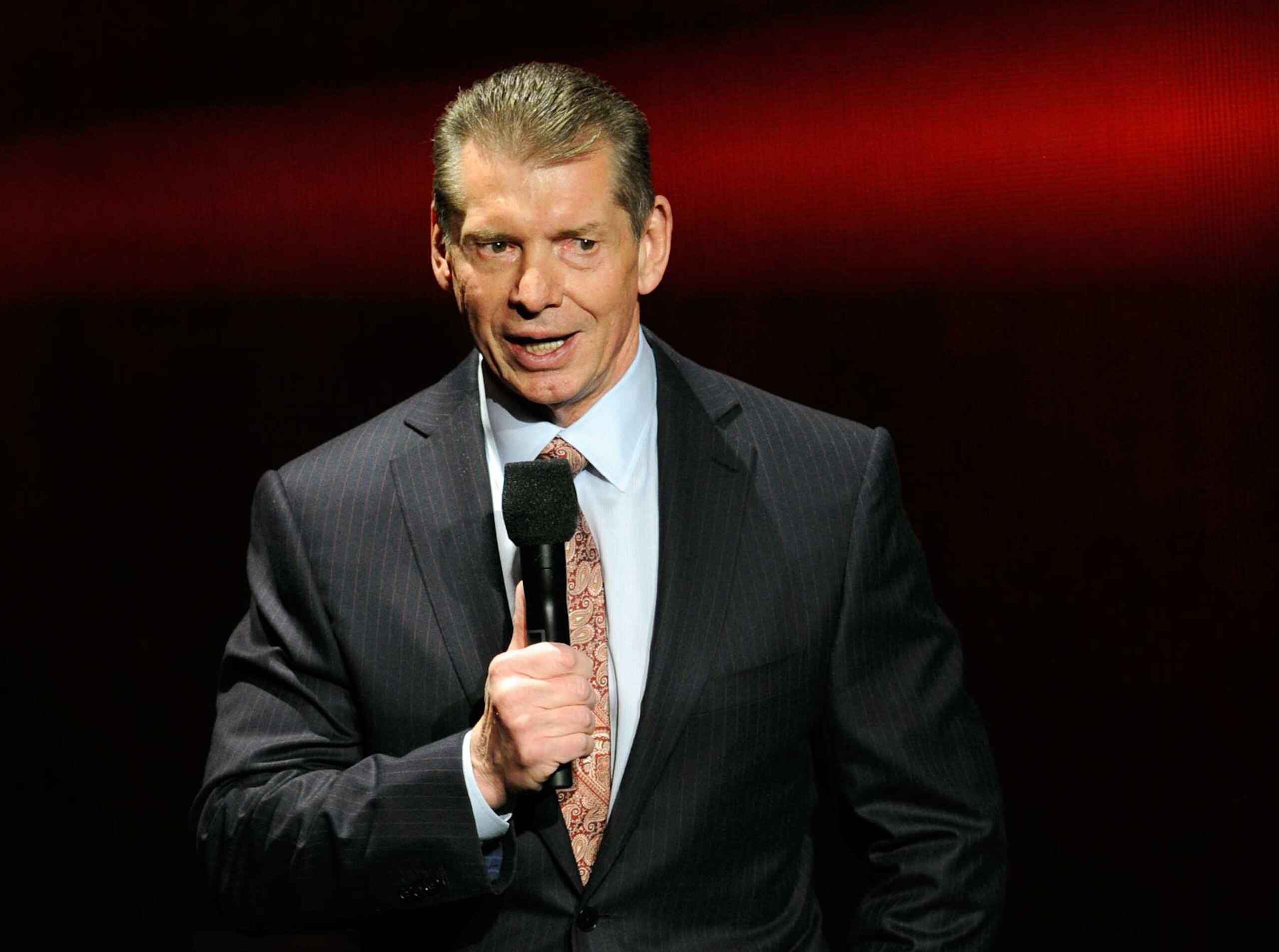 LAS VEGAS, NV - JANUARY 08: WWE Chairman and CEO Vince McMahon speaks at a news conference announcing the WWE Network at the 2014 International CES at the Encore Theater at Wynn Las Vegas on January 8, 2014 in Las Vegas, Nevada. The network will launch on February 24, 2014 as the first-ever 24/7 streaming network, offering both scheduled programs and video on demand. The USD 9.99 per month subscription will include access to all 12 live WWE pay-per-view events each year. CES, the world's largest annual consumer technology trade show, runs through January 10 and is expected to feature 3,200 exhibitors showing off their latest products and services to about 150,000 attendees. (Photo by Ethan Miller/Getty Images) LAS VEGAS, NV - JANUARY 08: WWE Chairman and CEO Vince McMahon speaks at a news conference announcing the WWE Network at the 2014 International CES at the Encore Theater at Wynn Las Vegas on January 8, 2014 in Las Vegas, Nevada. The network will launch on February 24, 2014 as the first-ever 24/7 streaming network, offering both scheduled programs and video on demand. The USD 9.99 per month subscription will include access to all 12 live WWE pay-per-view events each year. CES, the world's largest annual consumer technology trade show, runs through January 10 and is expected to feature 3,200 exhibitors showing off their latest products and services to about 150,000 attendees. (Photo by Ethan Miller/Getty Images)