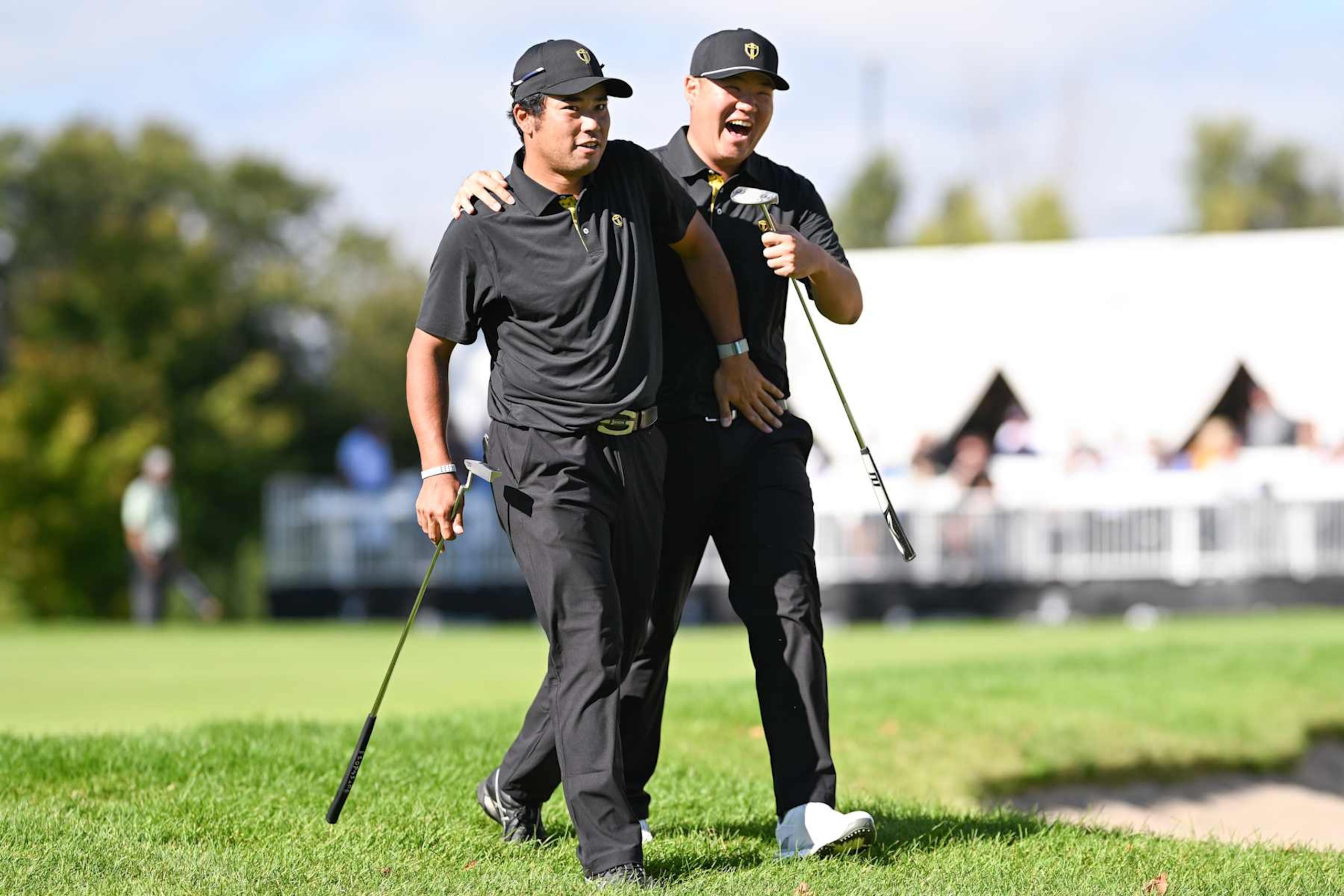 MONTREAL, QUEBEC - SEPTEMBER 27: Sungjae Im and Hideki Matsuyama of the International Team react to a birdie putt on the 10th green during Friday's Foursomes matches on day two of the 2024 Presidents Cup at The Royal Montreal Golf Club on September 27, 2024 in Montreal, Quebec. (Photo by Keyur Khamar/PGA TOUR via Getty Images)