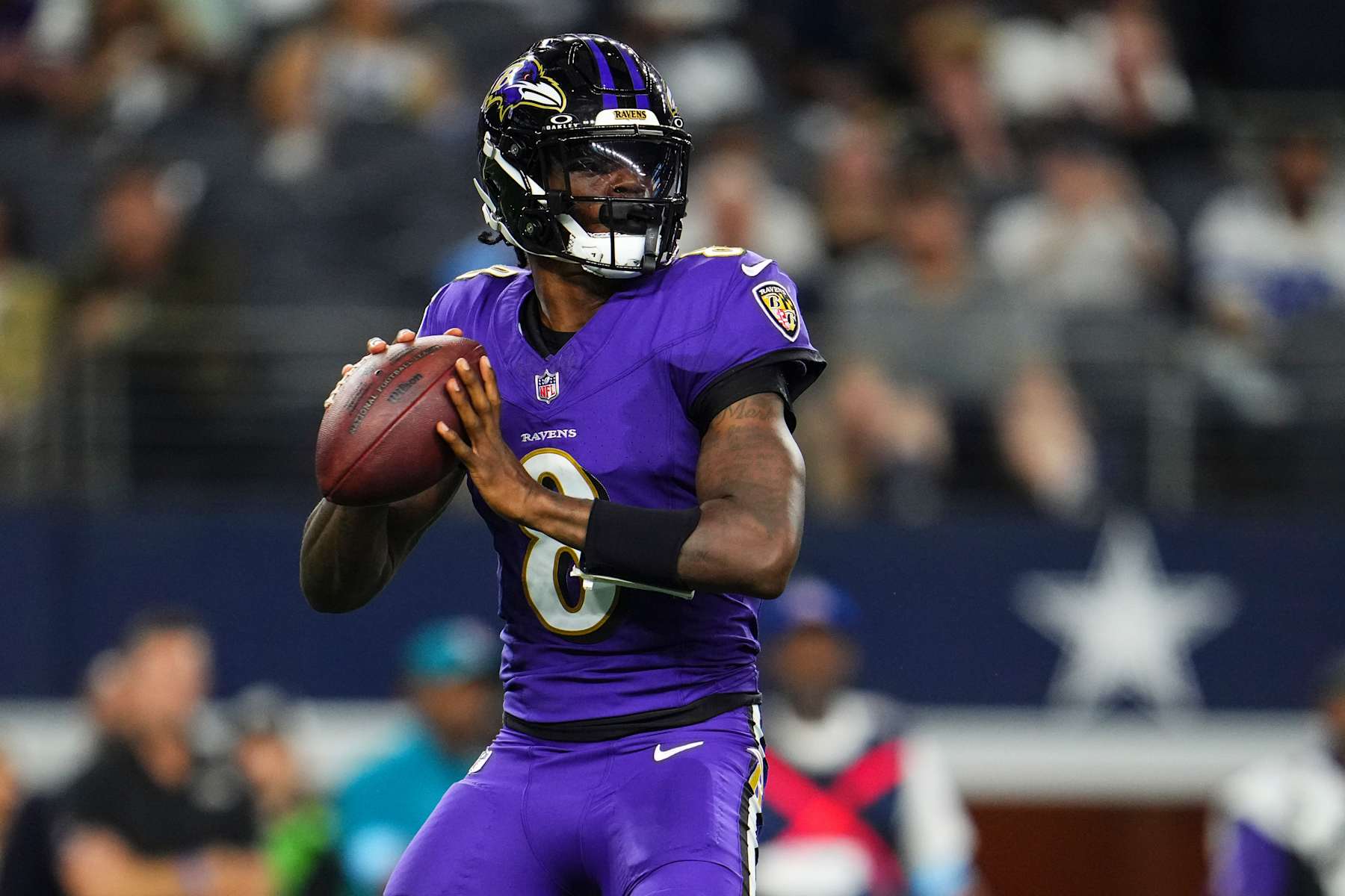 ARLINGTON, TX - SEPTEMBER 22: Lamar Jackson #8 of the Baltimore Ravens throws the ball during an NFL football game against the Dallas Cowboys at AT&T Stadium on September 22, 2024 in Arlington, Texas. (Photo by Cooper Neill/Getty Images)